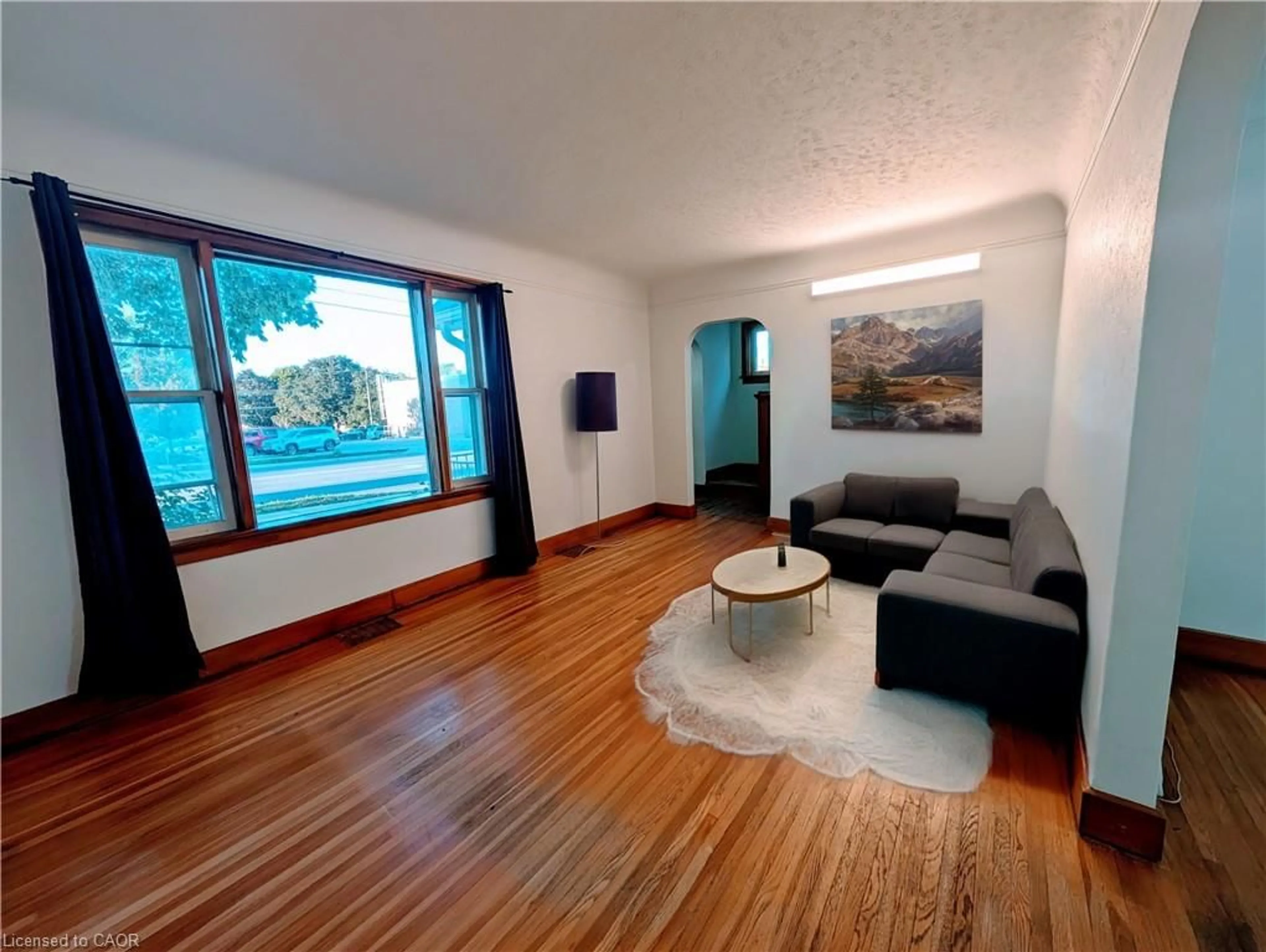 Living room with furniture, wood/laminate floor for 185 Highland Rd, Kitchener Ontario N2M 3C1