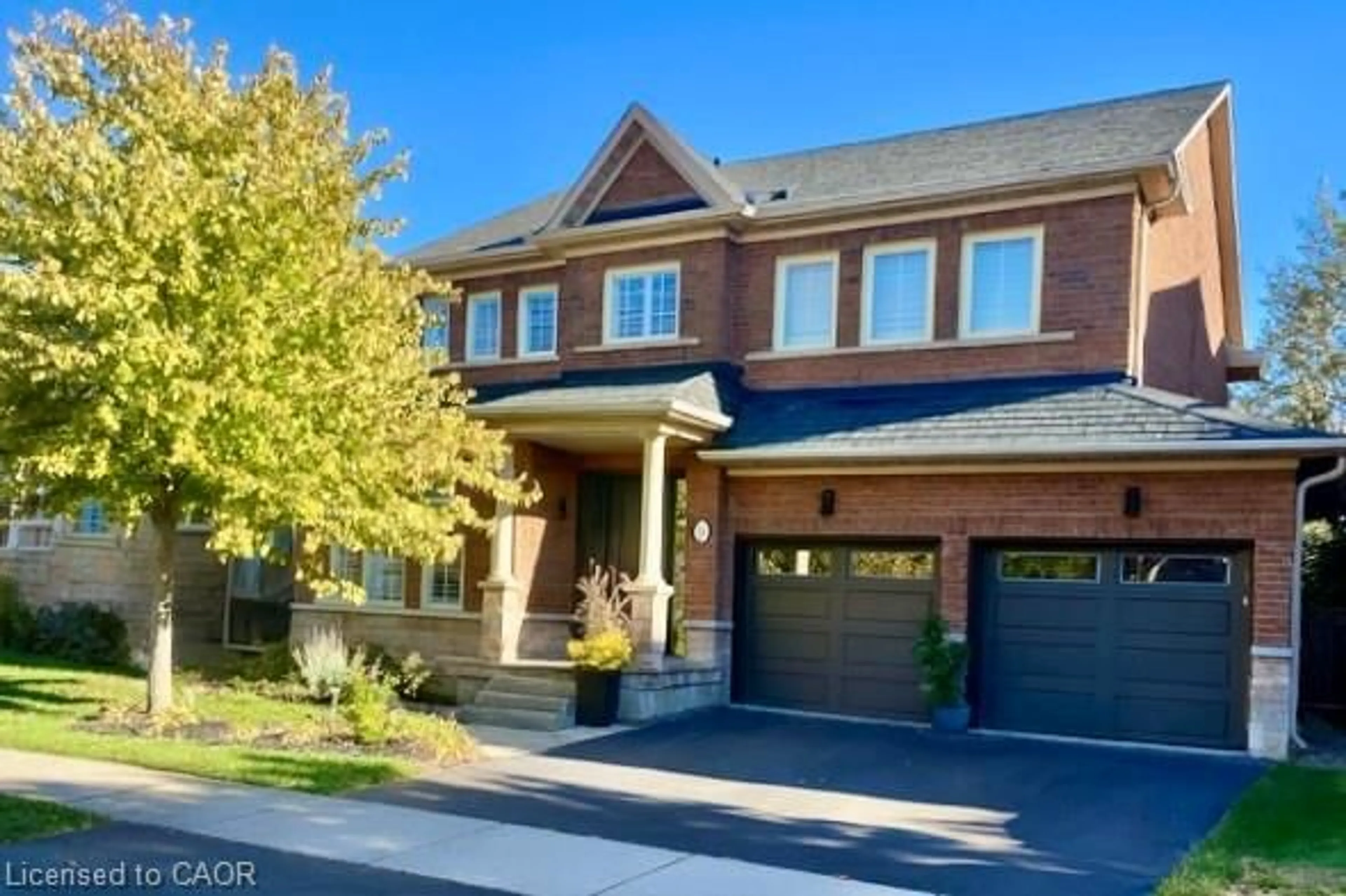 Home with brick exterior material, street for 273 Duskywing Way, Oakville Ontario L6L 6X5