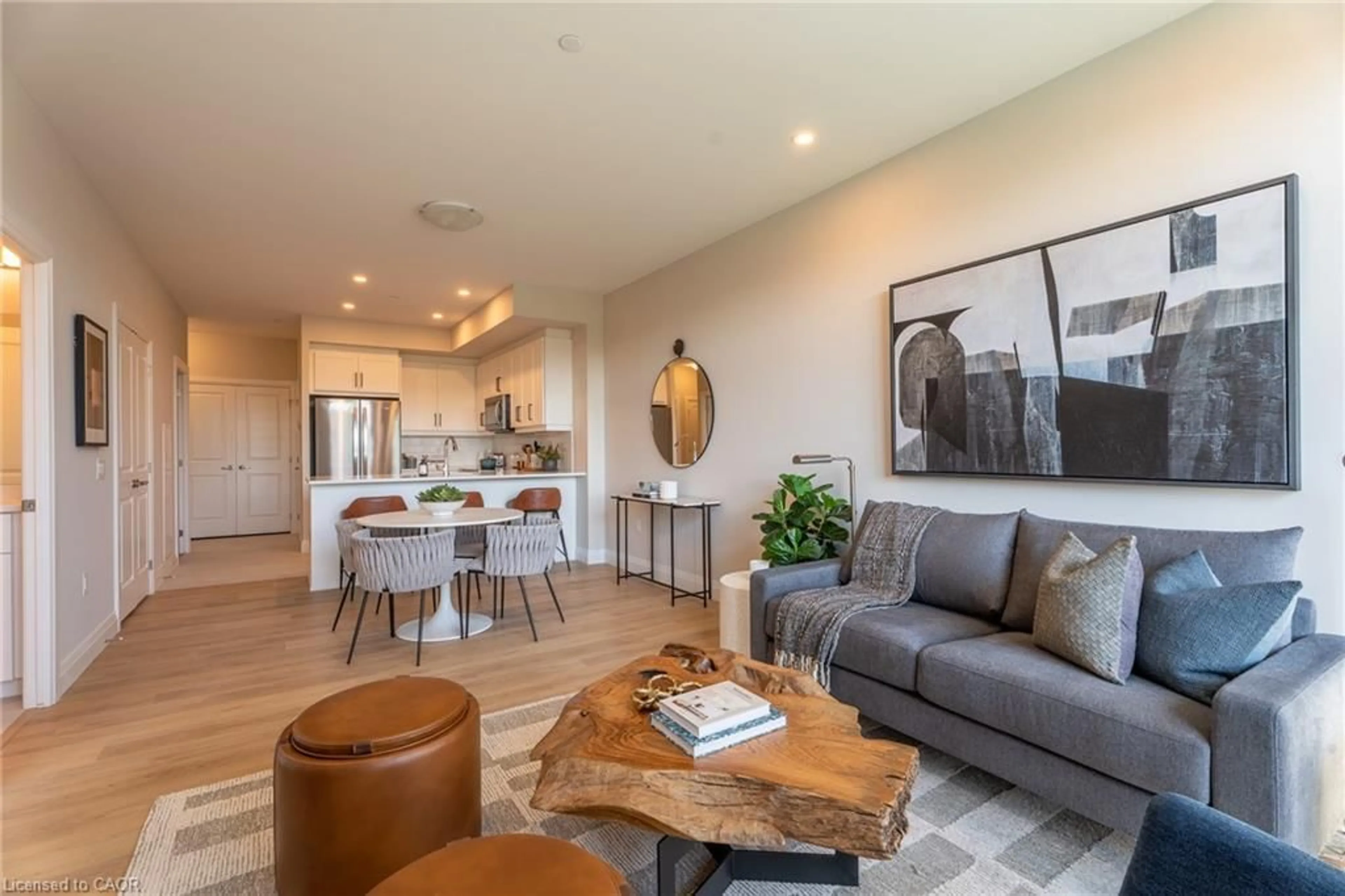 Living room with furniture, wood/laminate floor for 1882 Gordon St #215, Guelph Ontario N1L 0P6