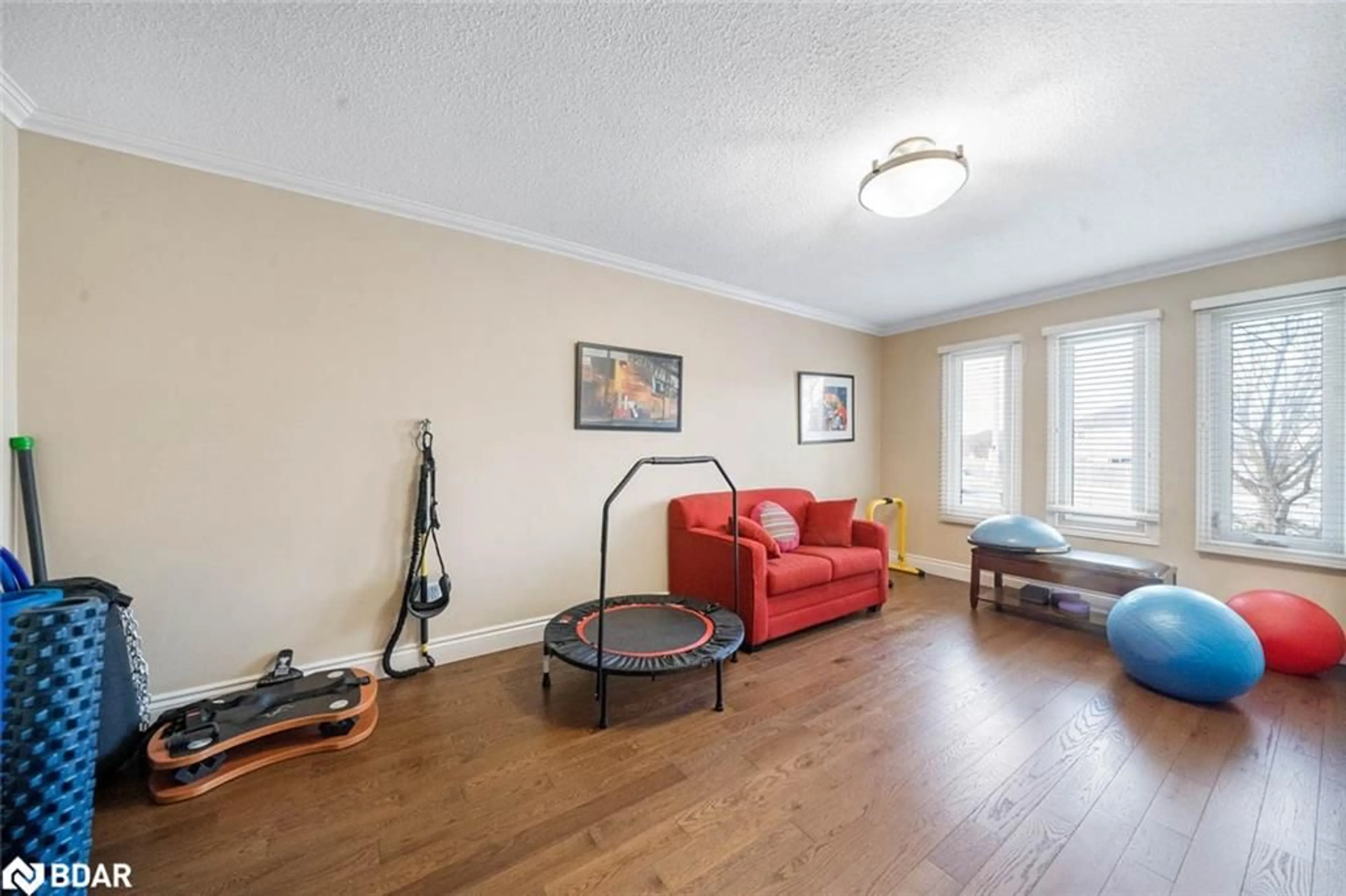 Living room with furniture, wood/laminate floor for 456 St Vincent St, Barrie Ontario L4M 6C8