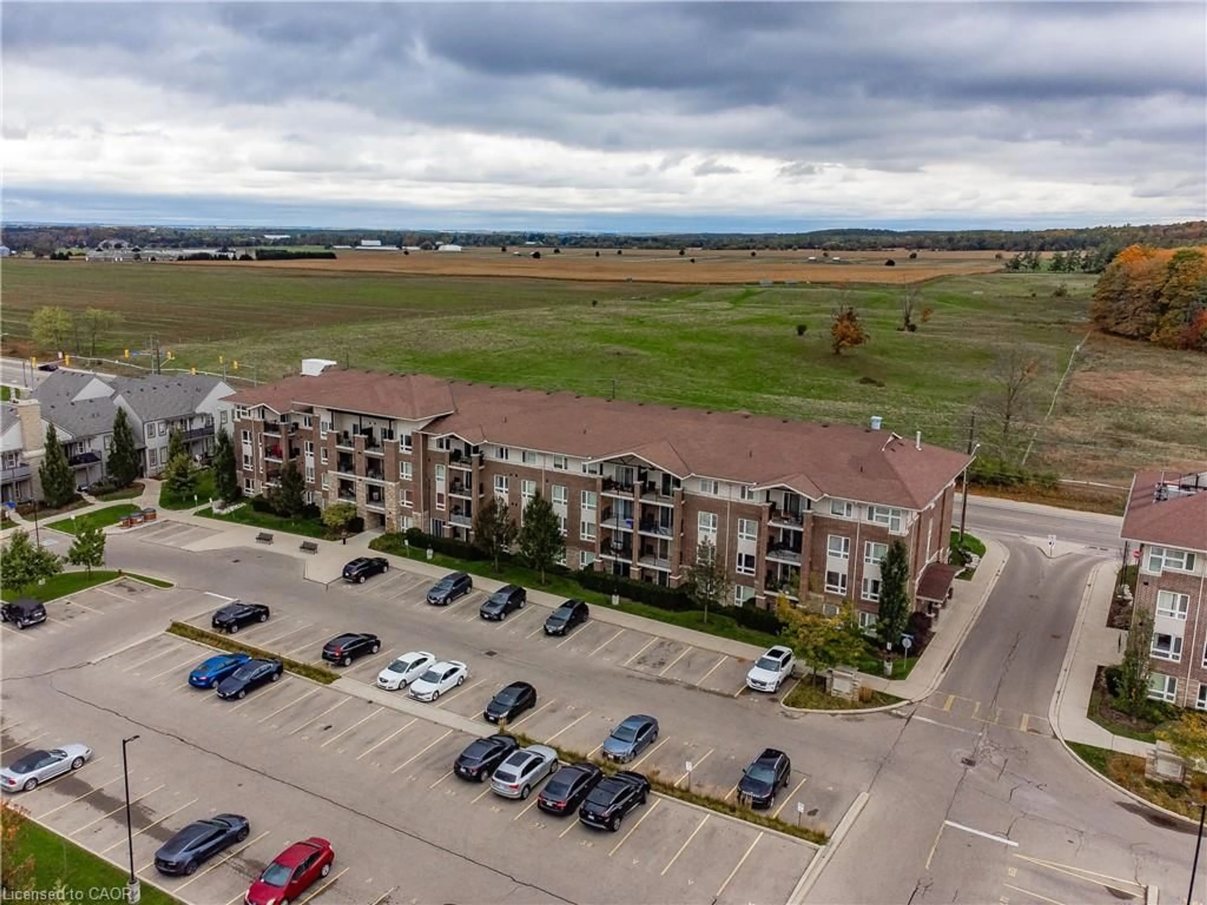 A pic from outside/outdoor area/front of a property/back of a property/a pic from drone, unknown for 67 Kingsbury Sq #411, Guelph Ontario N1L 0L3