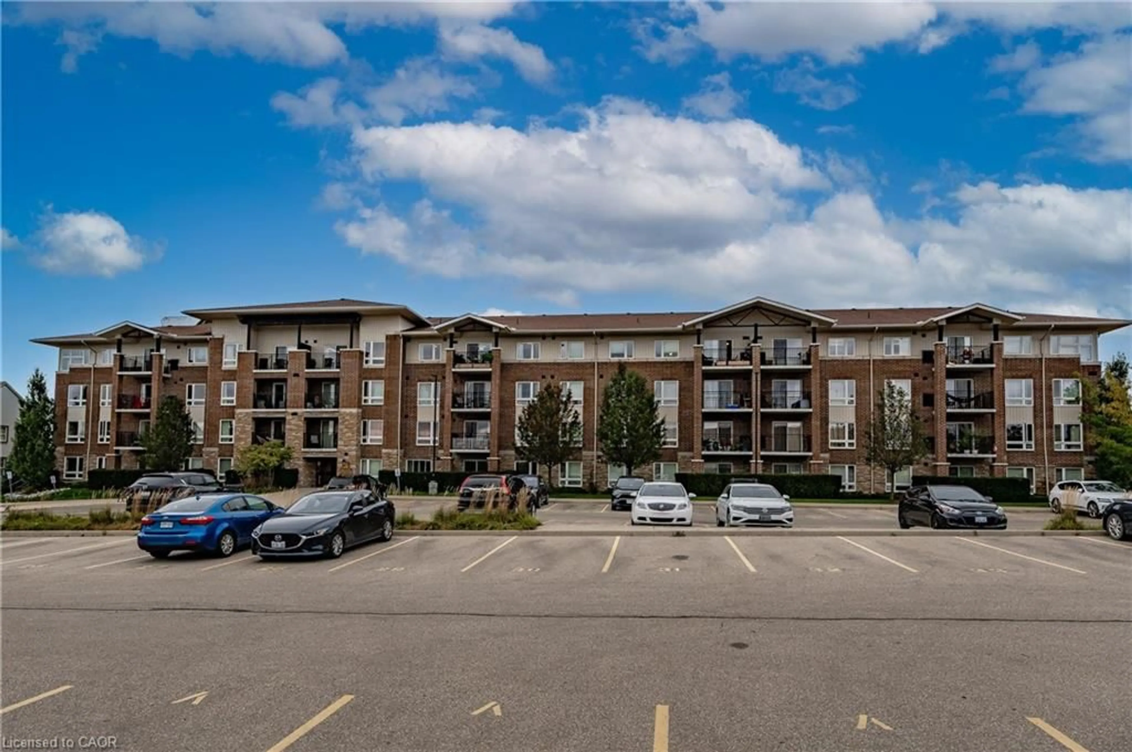 A pic from outside/outdoor area/front of a property/back of a property/a pic from drone, unknown for 67 Kingsbury Sq #411, Guelph Ontario N1L 0L3