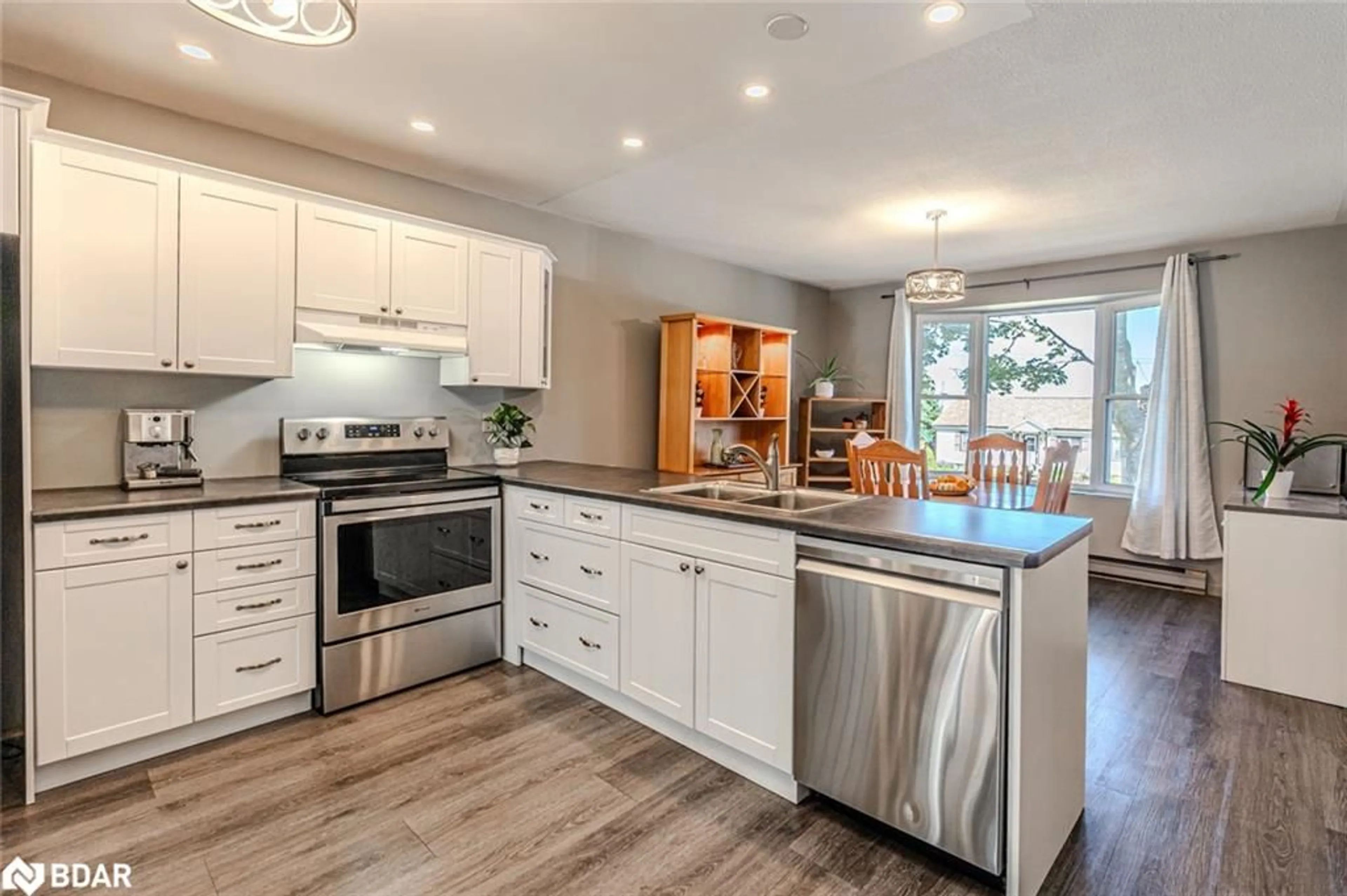 Open concept kitchen, wood/laminate floor for 29 First Street, Orillia Ontario L3V 4A8
