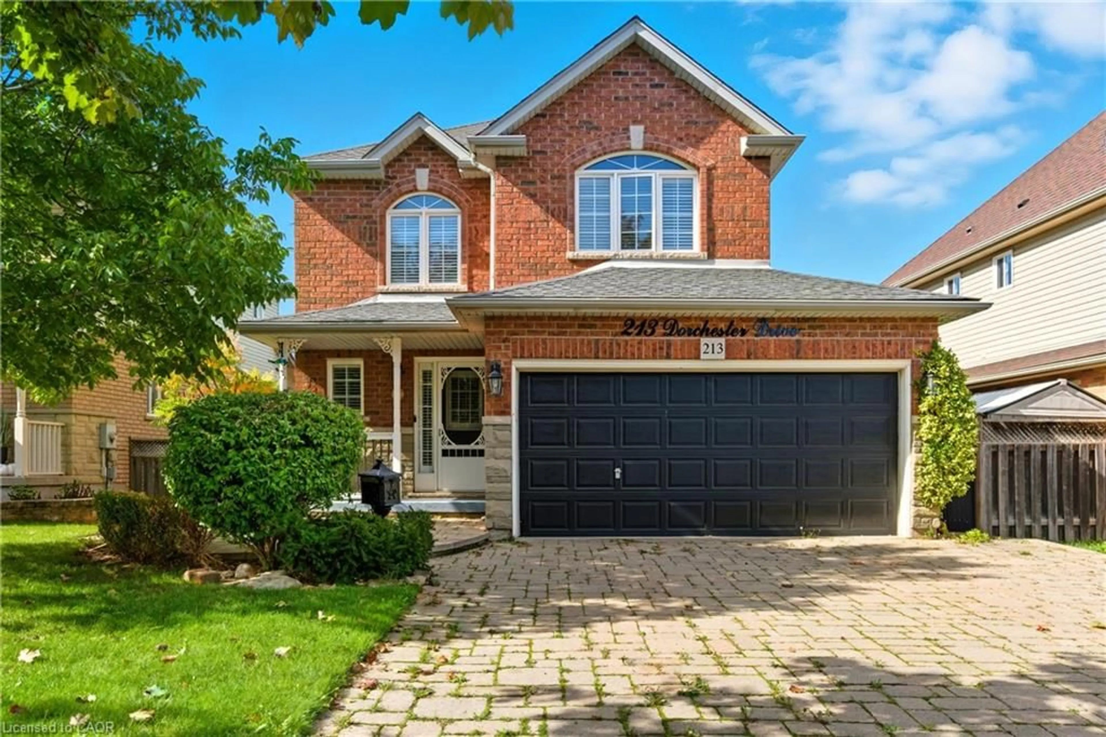 Home with brick exterior material, street for 213 Dorchester Dr, Grimsby Ontario L3M 5K8