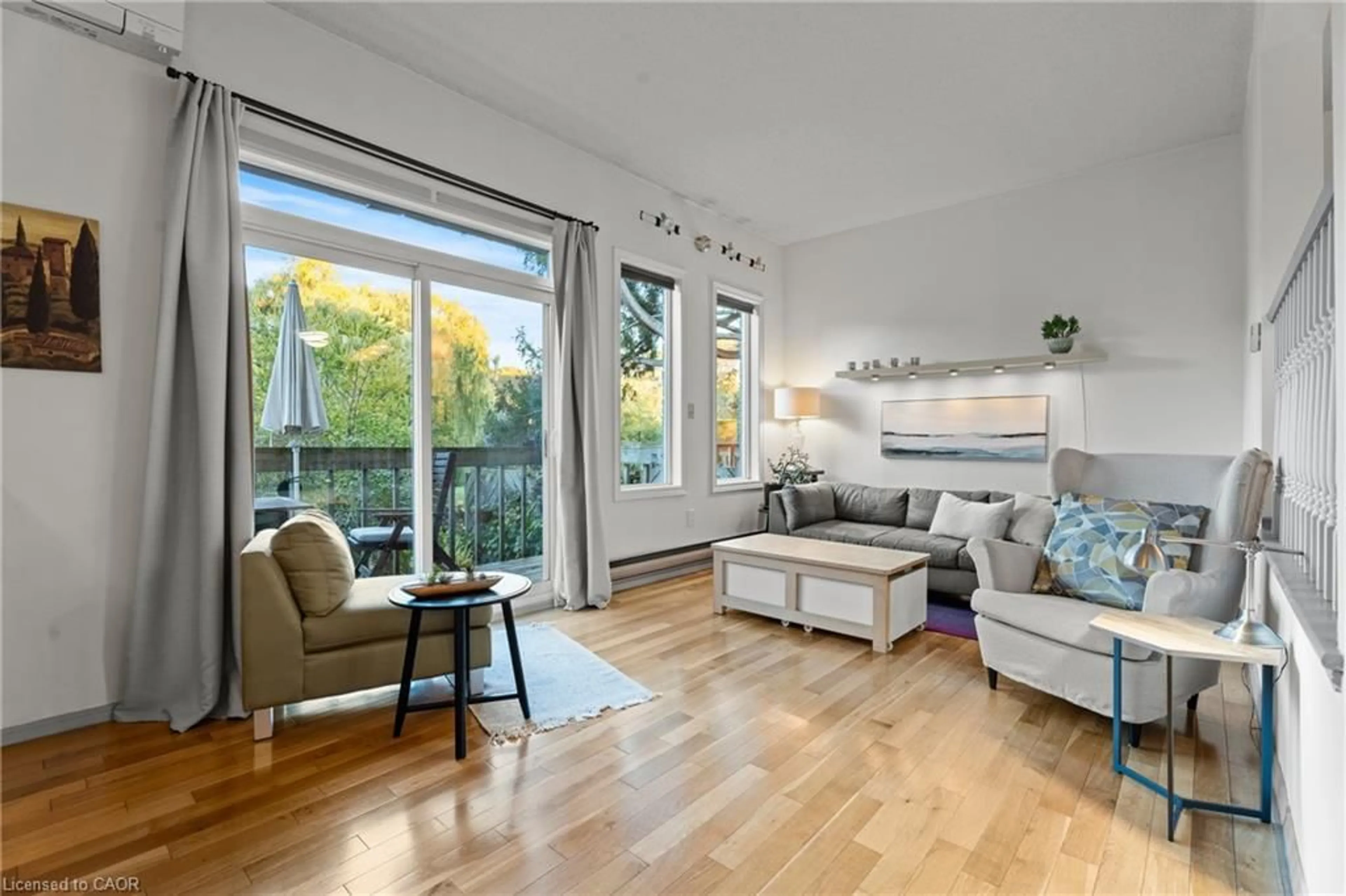 Living room with furniture, wood/laminate floor for 1967 Main St #7, Hamilton Ontario L8S 4P4