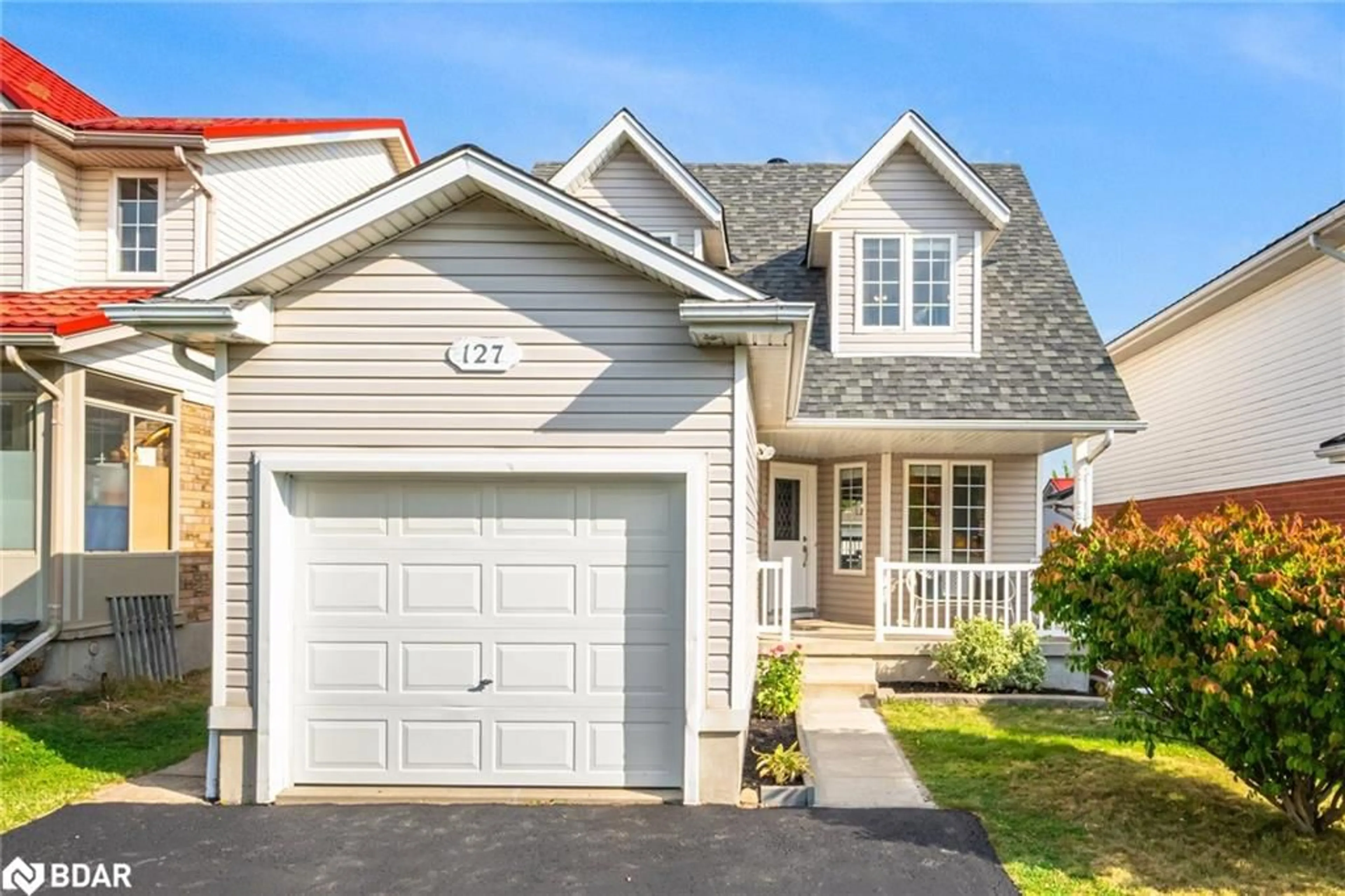 Home with vinyl exterior material, street for 127 Silurian Dr, Guelph Ontario N1E 7G2