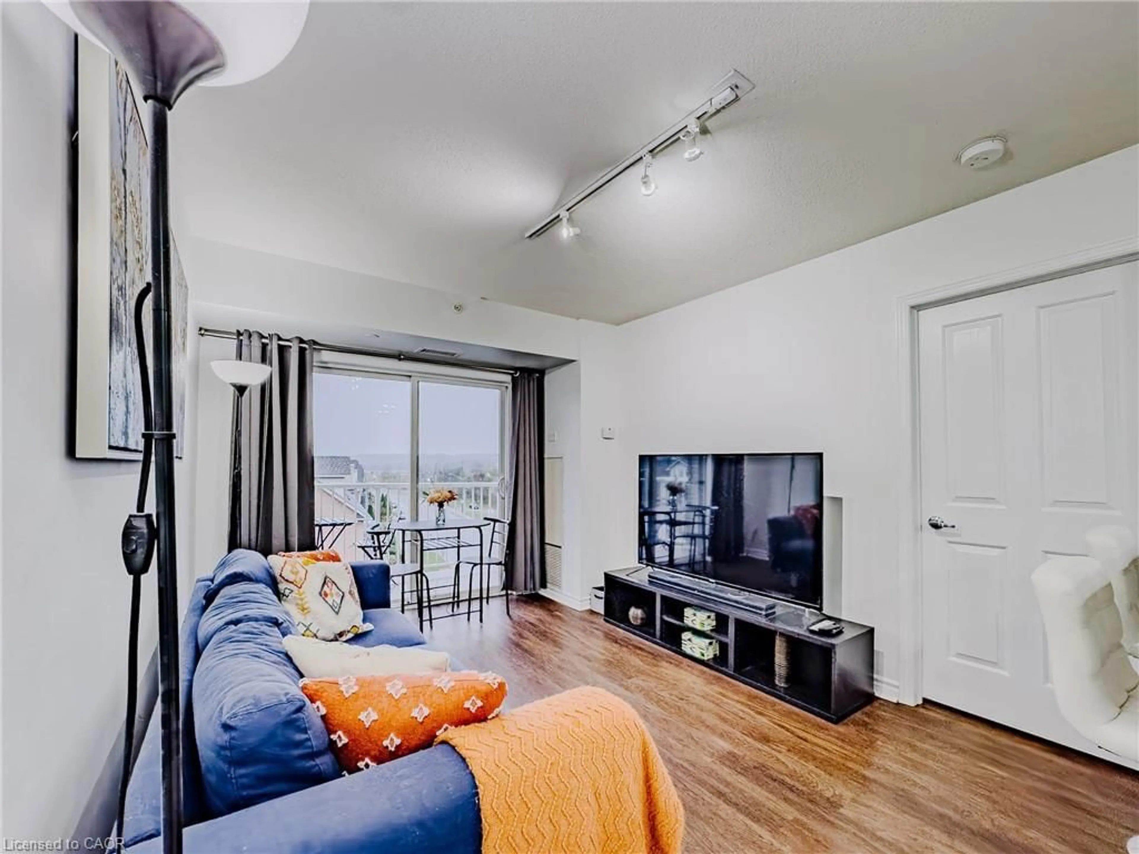 Living room with furniture, wood/laminate floor for 8 Harris St #422, Cambridge Ontario N1R 8R1