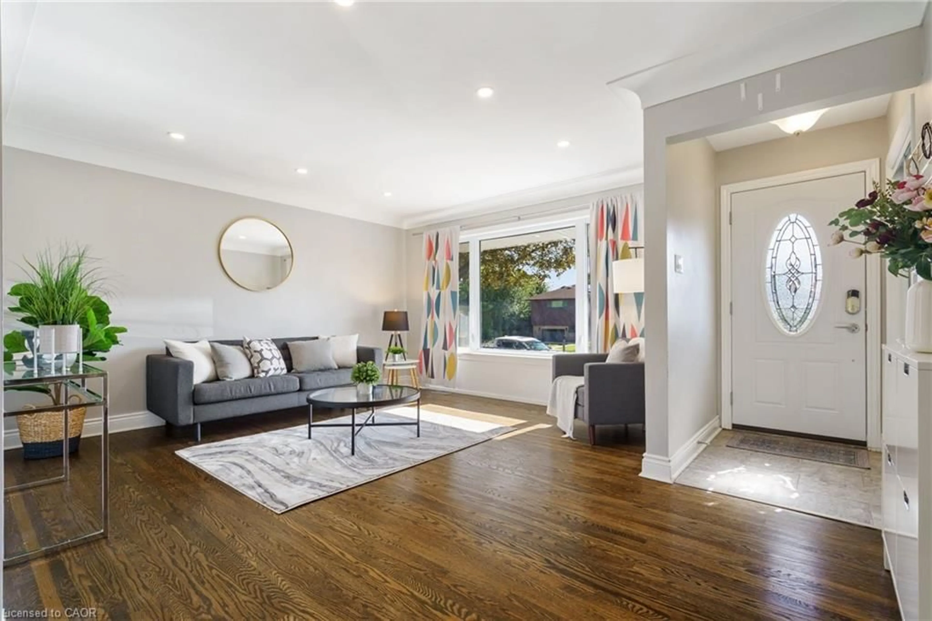 Living room with furniture, wood/laminate floor for 109 Organ Cres, Hamilton Ontario L8T 1Y8