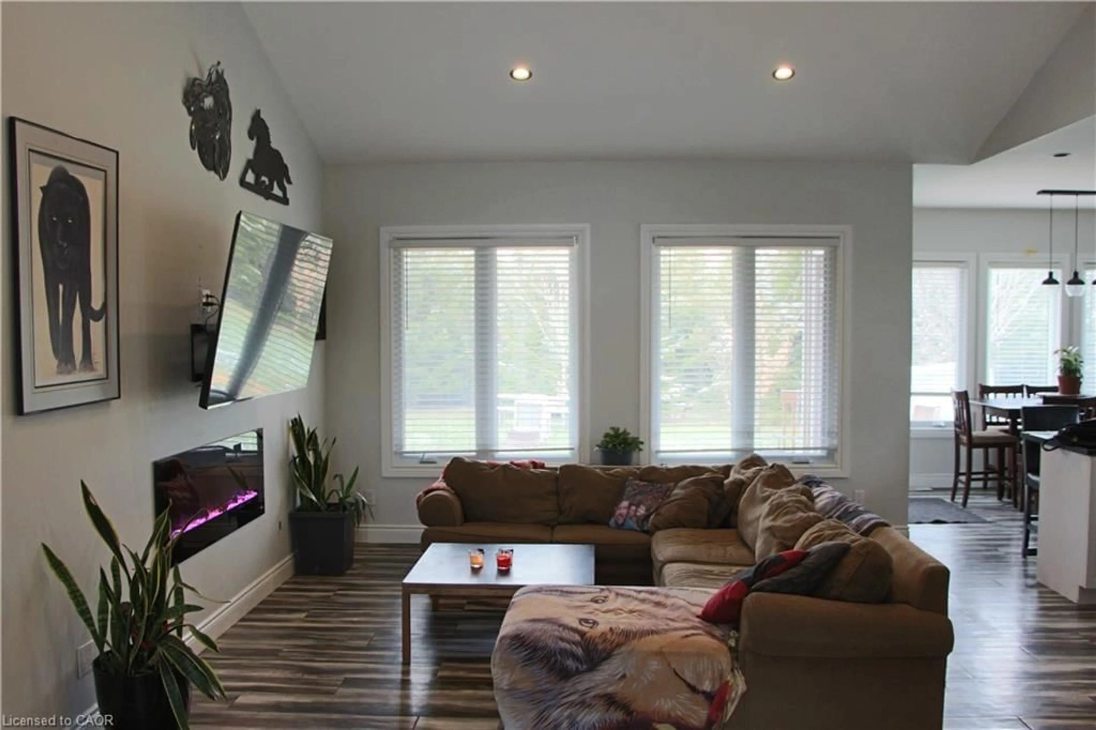 Living room with furniture, wood/laminate floor for 38812 Vienna St, Varna Ontario N0M 2R0