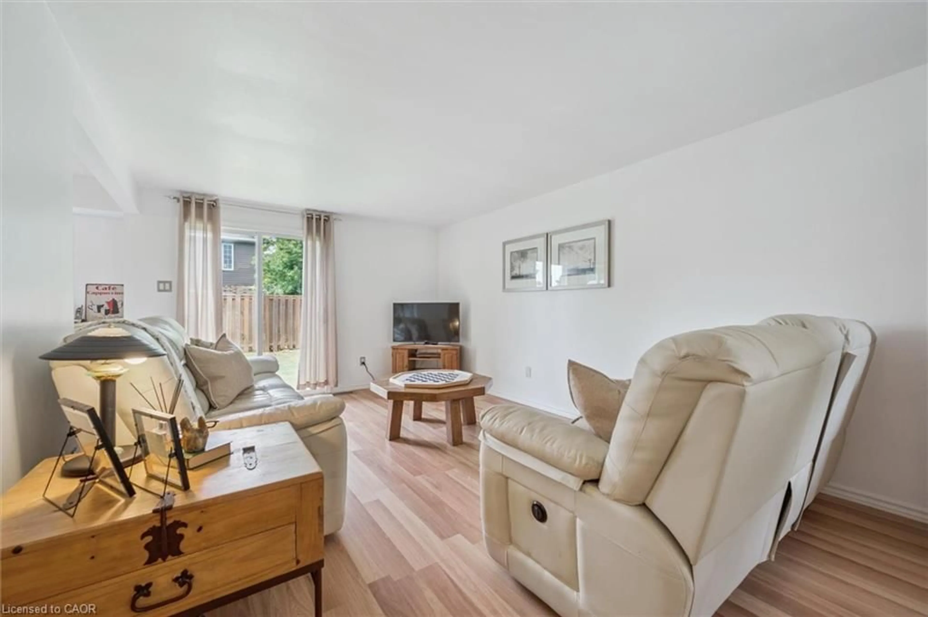 Living room with furniture, wood/laminate floor for 289 Strathallan St, Fergus Ontario N1M 3L6