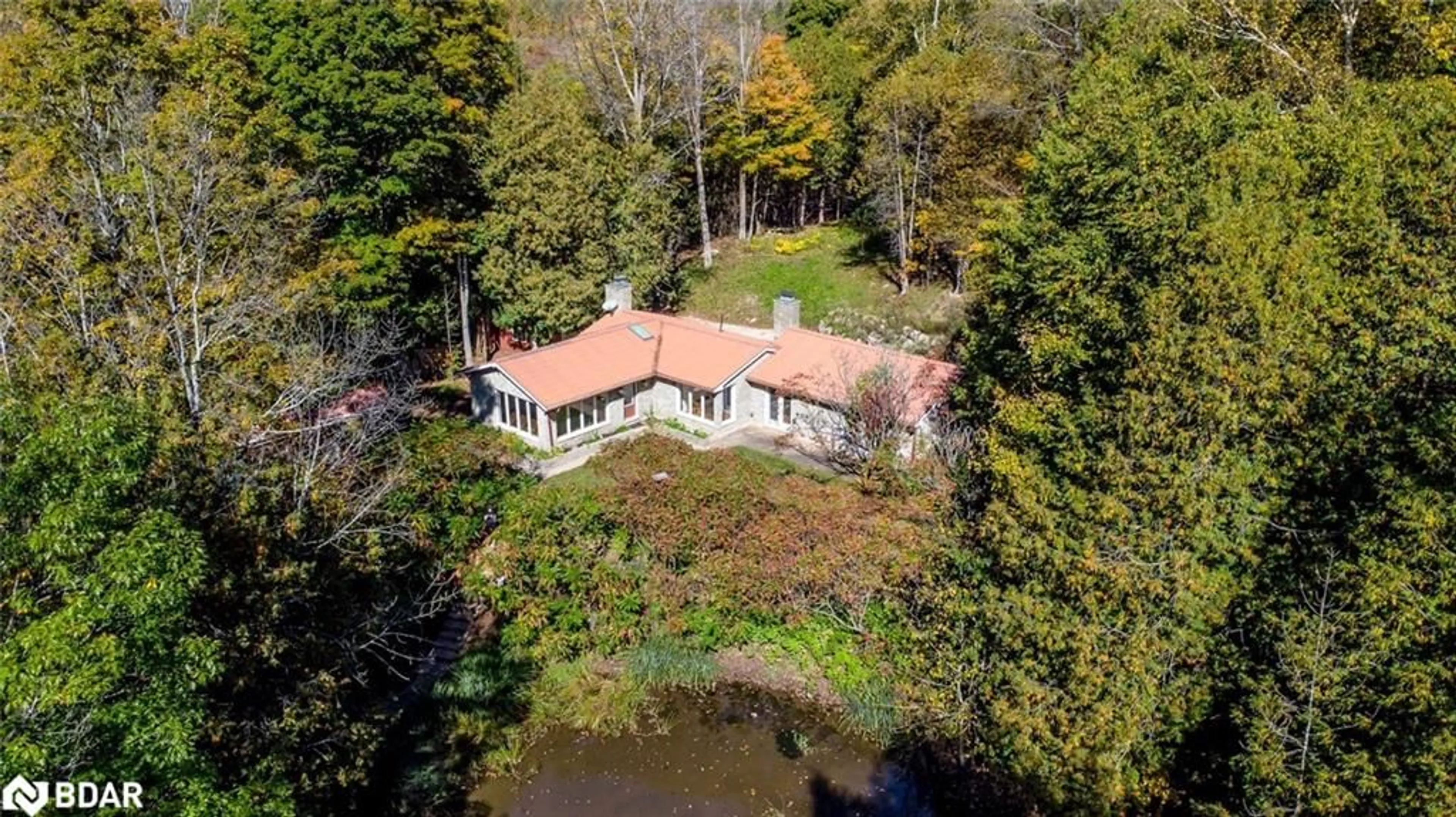 A pic from outside/outdoor area/front of a property/back of a property/a pic from drone, water/lake/river/ocean view for 8275 County Rd 9, Creemore Ontario L0M 1G0