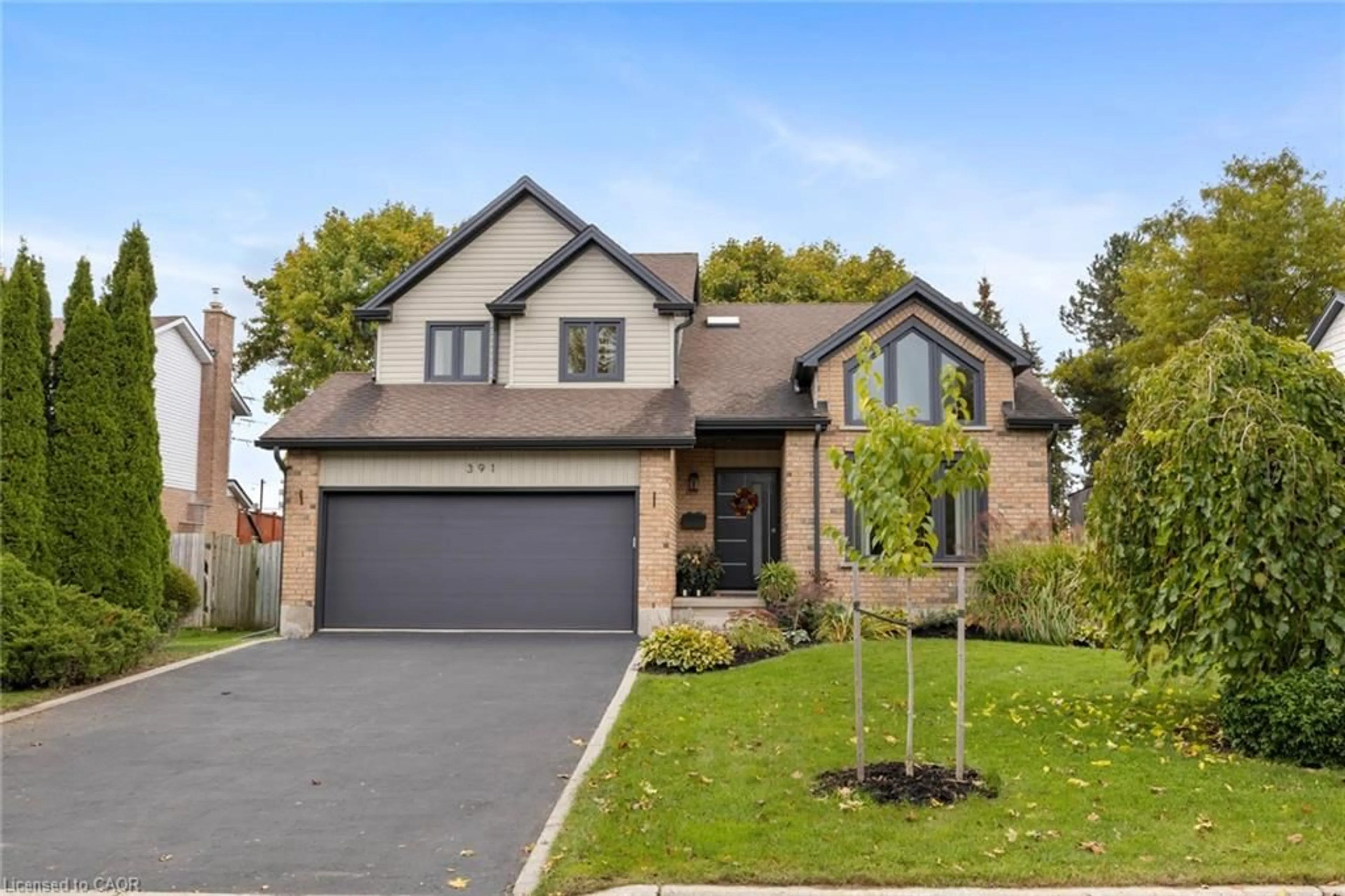 Home with brick exterior material, street for 391 Strawberry Cres, Waterloo Ontario N2K 3J4