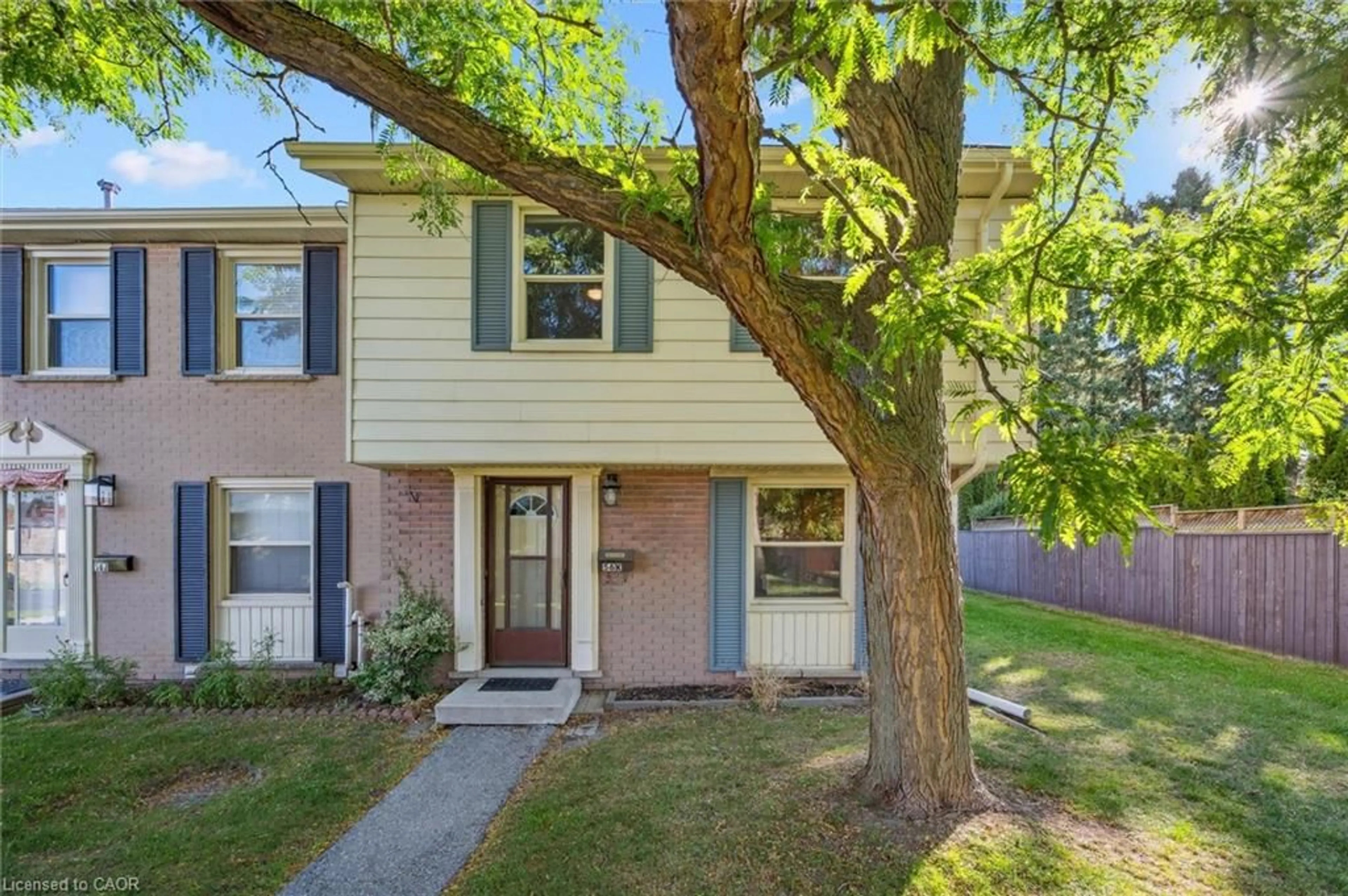 Home with vinyl exterior material, street for 56 Montcalm Dr #K, Kitchener Ontario N2B 2R1