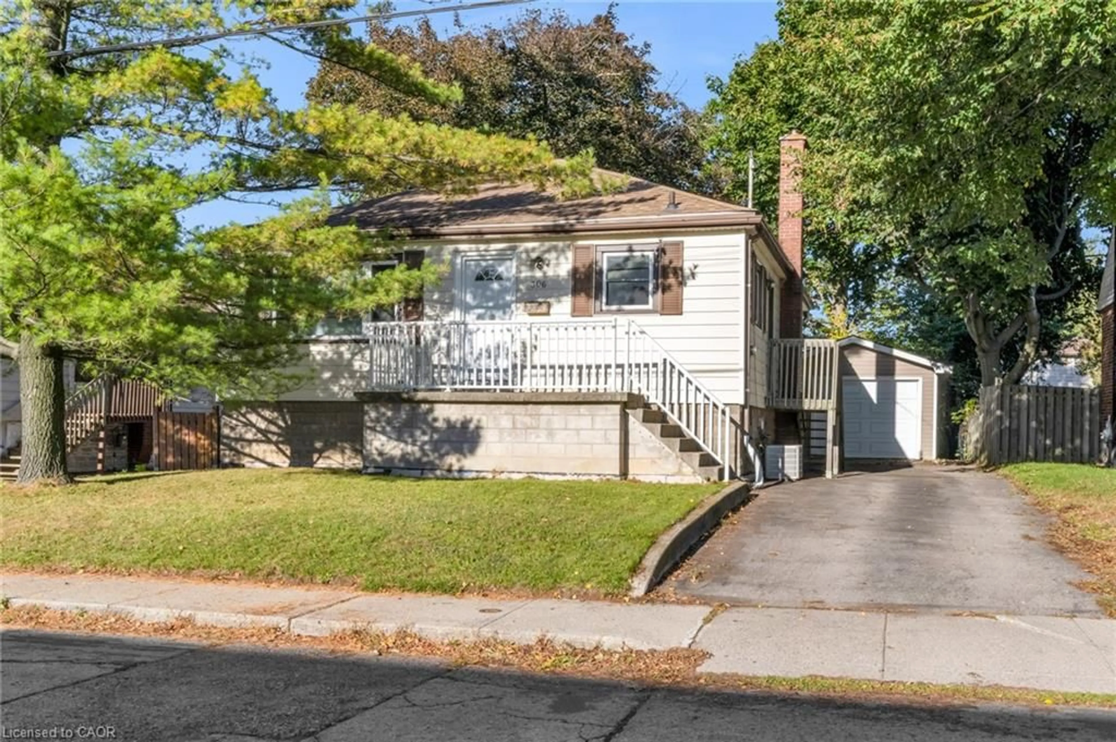 Home with vinyl exterior material, street for 306 West 2nd St, Hamilton Ontario L9C 3H2