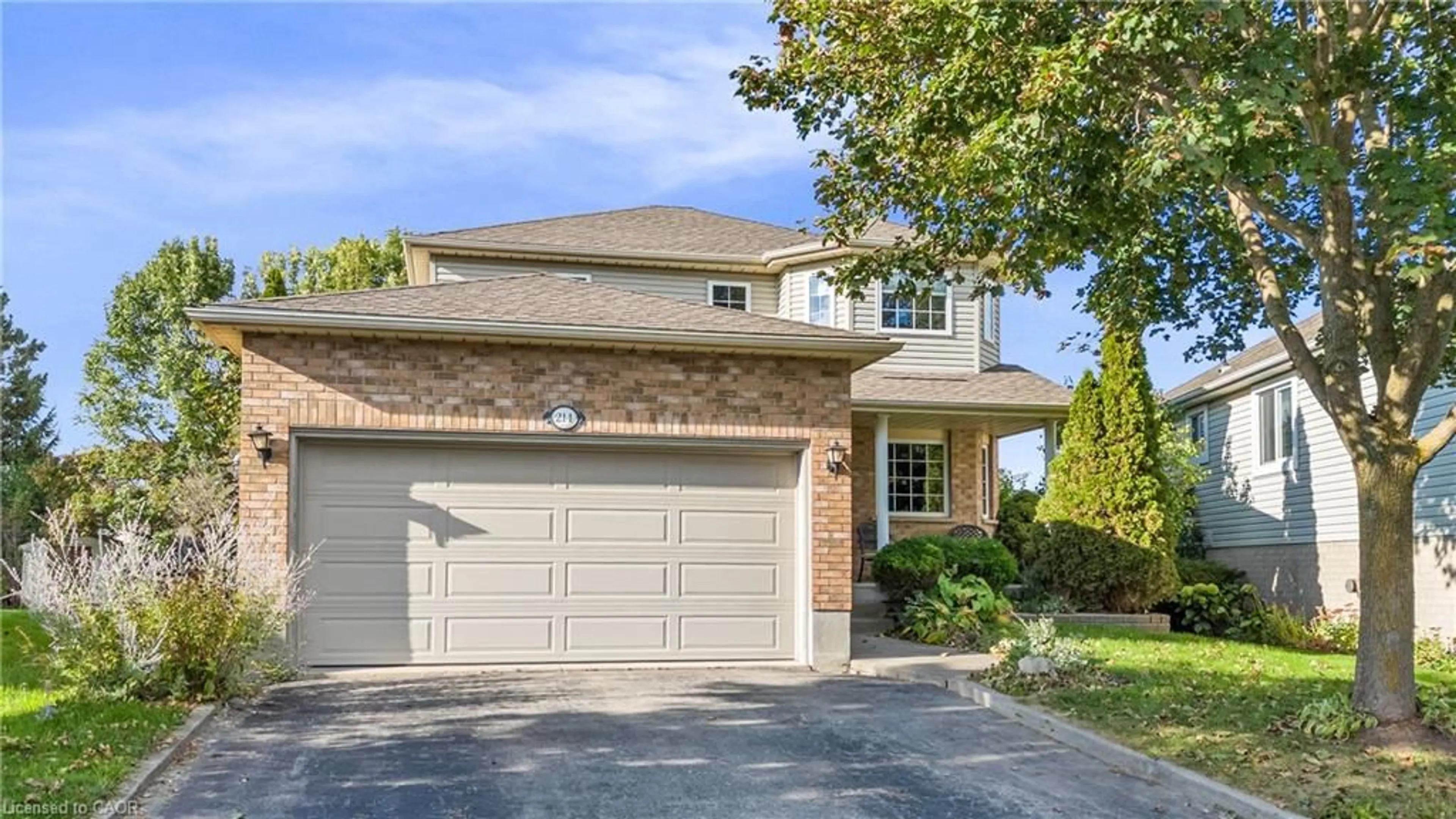 Home with brick exterior material, street for 214 Dartmoor Cres, Waterloo Ontario N2K 3S9