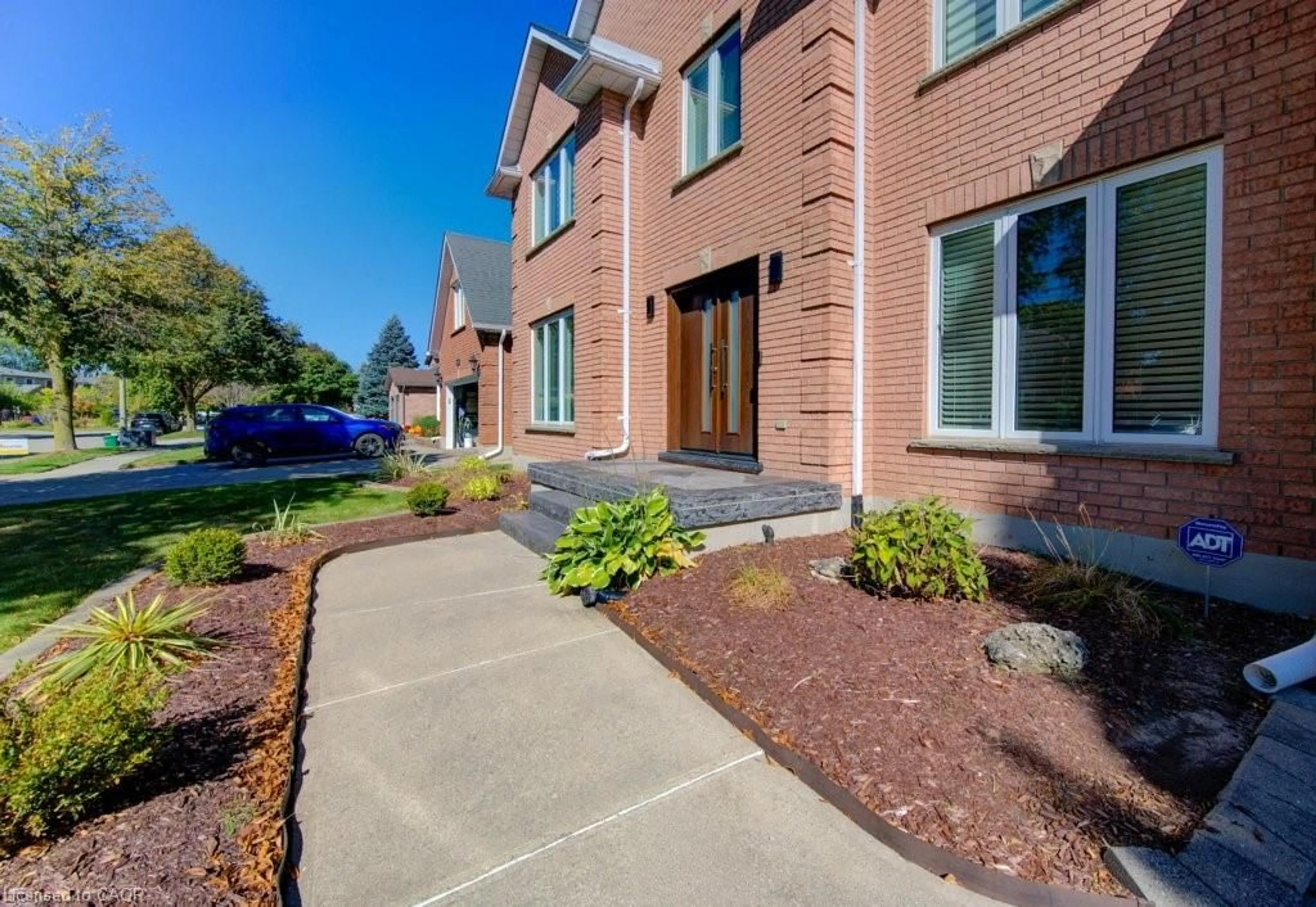 Home with brick exterior material, street for 610 Stonebury Cres, Waterloo Ontario N2K 3R1