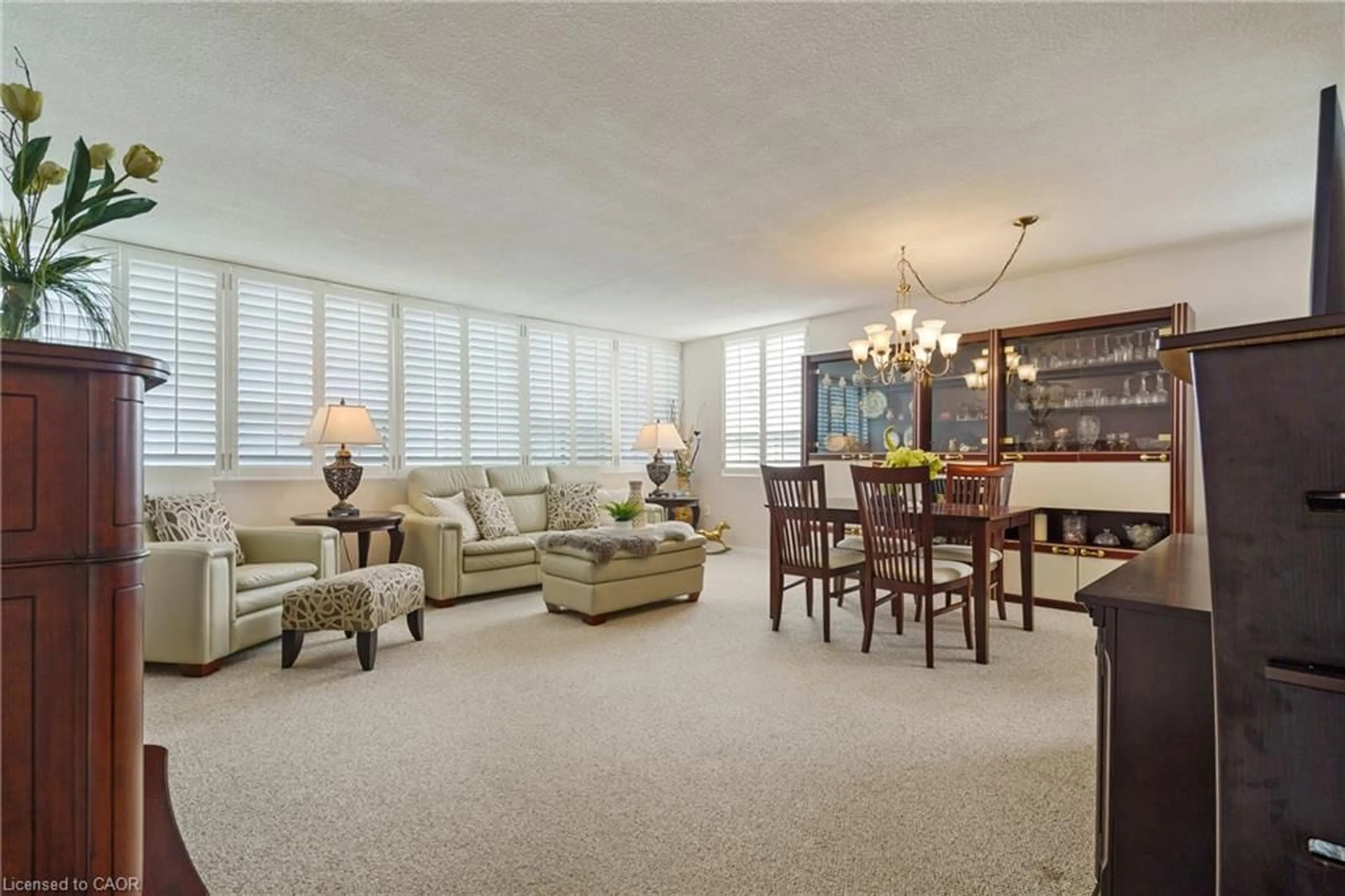 Living room with furniture, carpet floor for 120 Duke St #403, Hamilton Ontario L8P 4T1