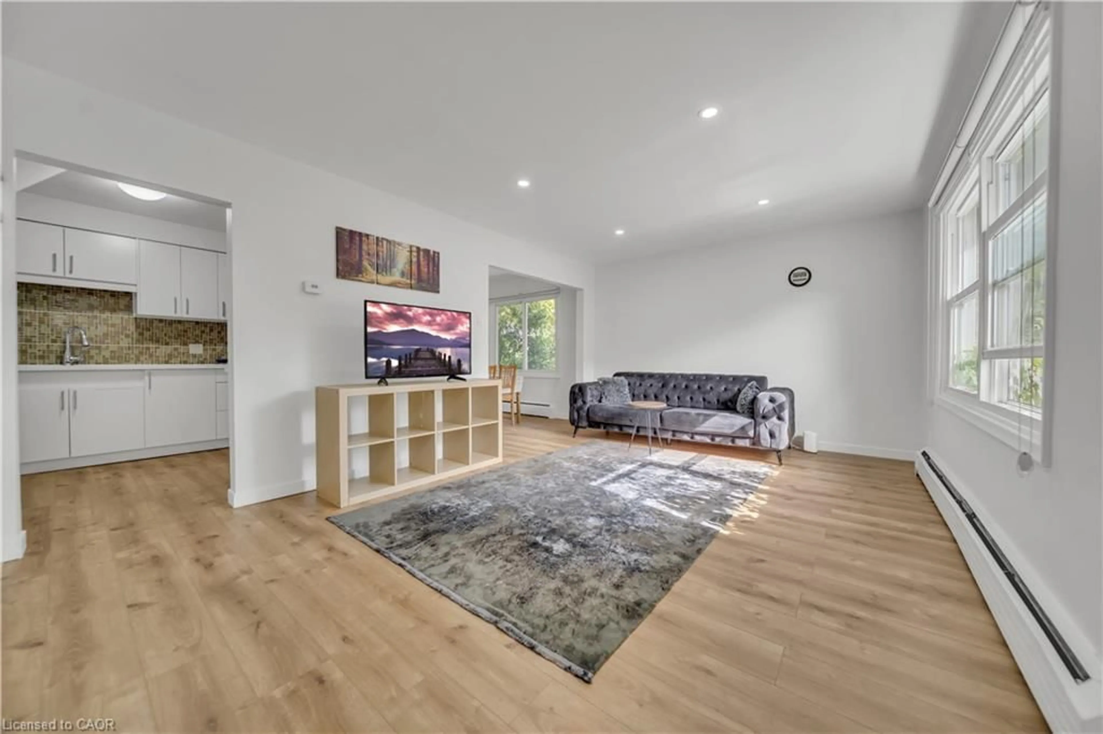 Living room with furniture, wood/laminate floor for 78 Borden Pky #11, Kitchener Ontario N2M 3T4
