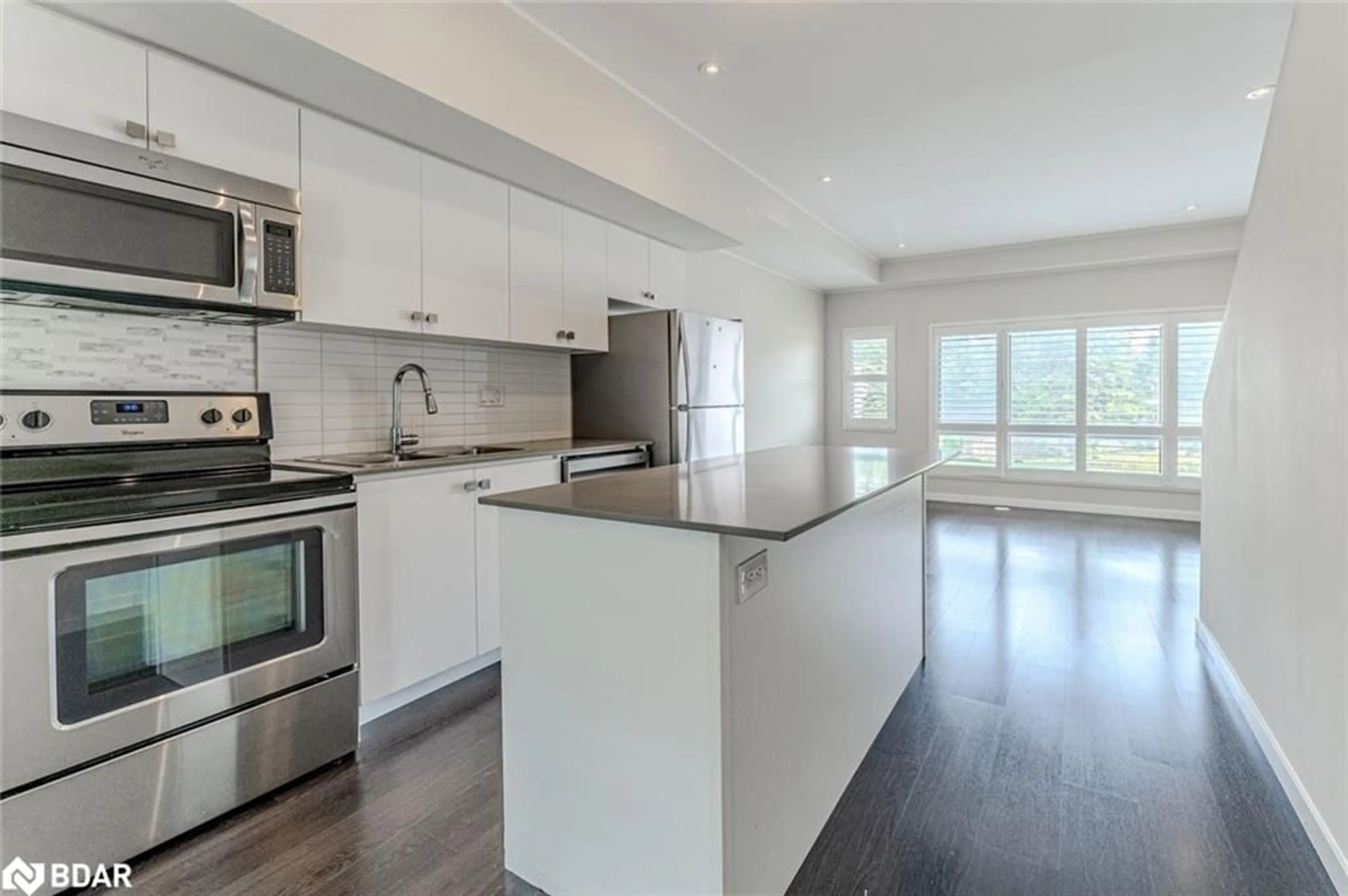 Open concept kitchen, wood/laminate floor for 369 Essa Road #14, Barrie Ontario L4N 9C8