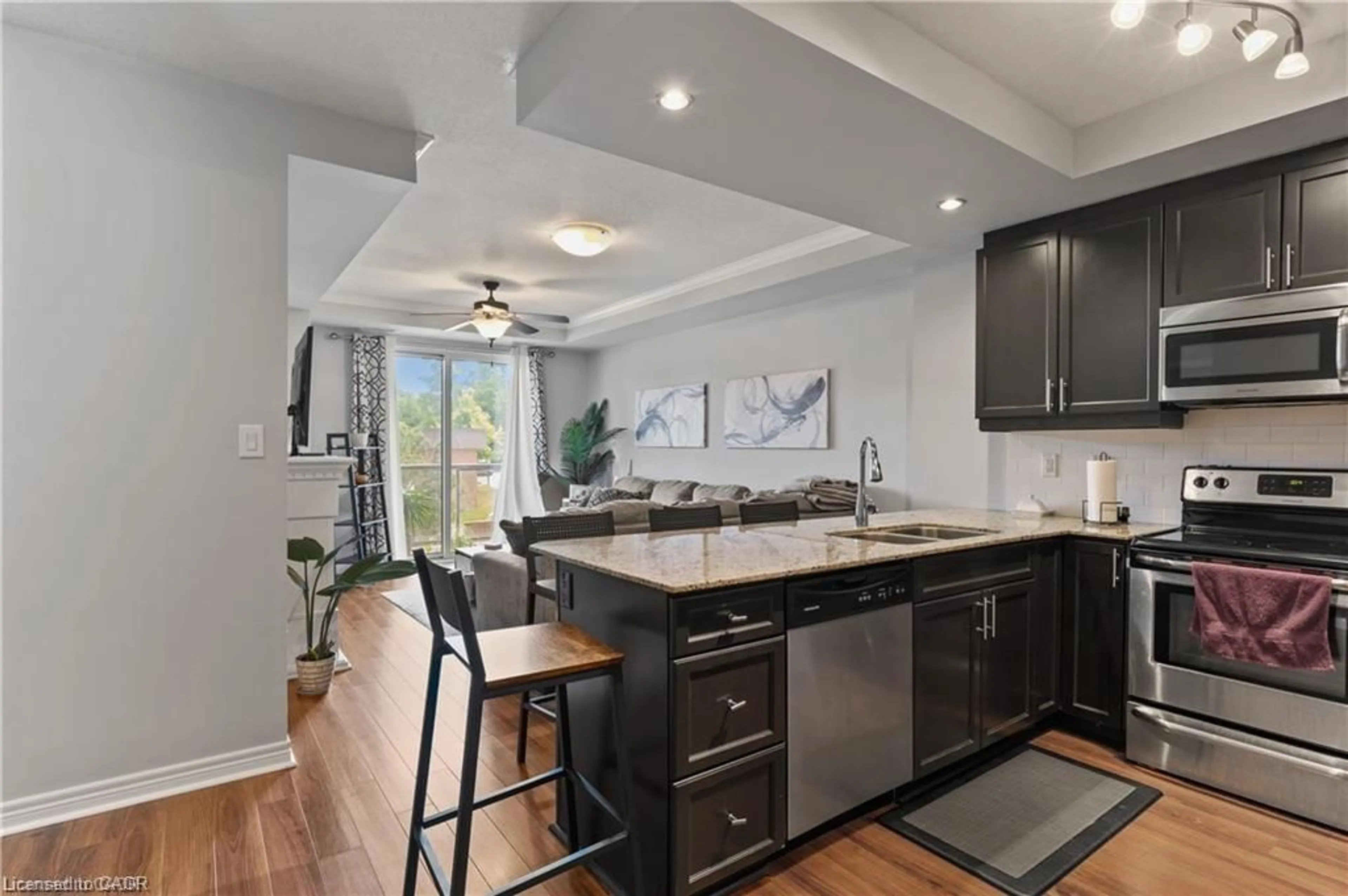 Open concept kitchen, ceramic/tile floor for 539 Belmont Ave #210, Kitchener Ontario N2M 0A2