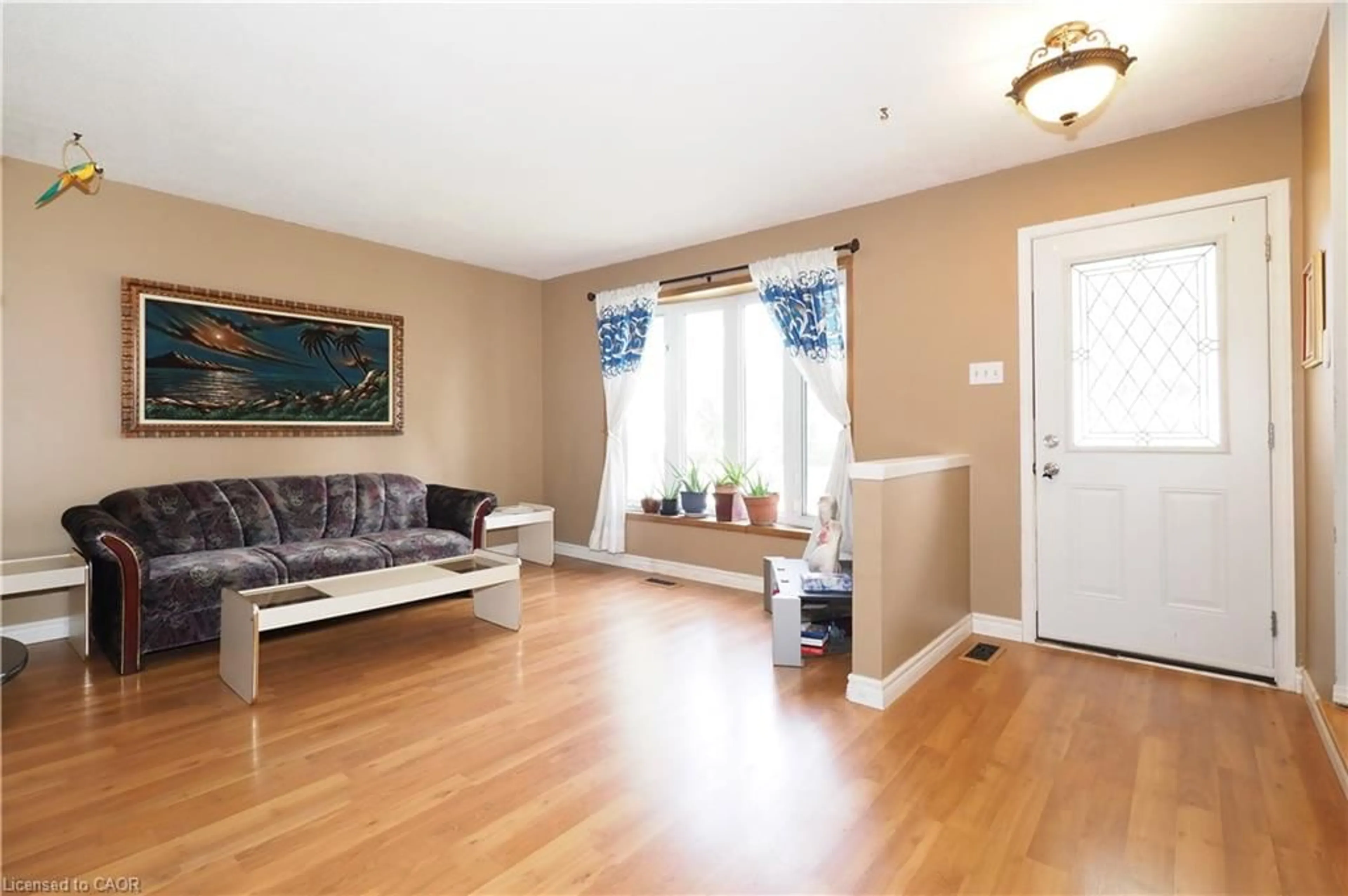 Living room with furniture, wood/laminate floor for 10 Balfour Cres, Kitchener Ontario N2C 1Z5