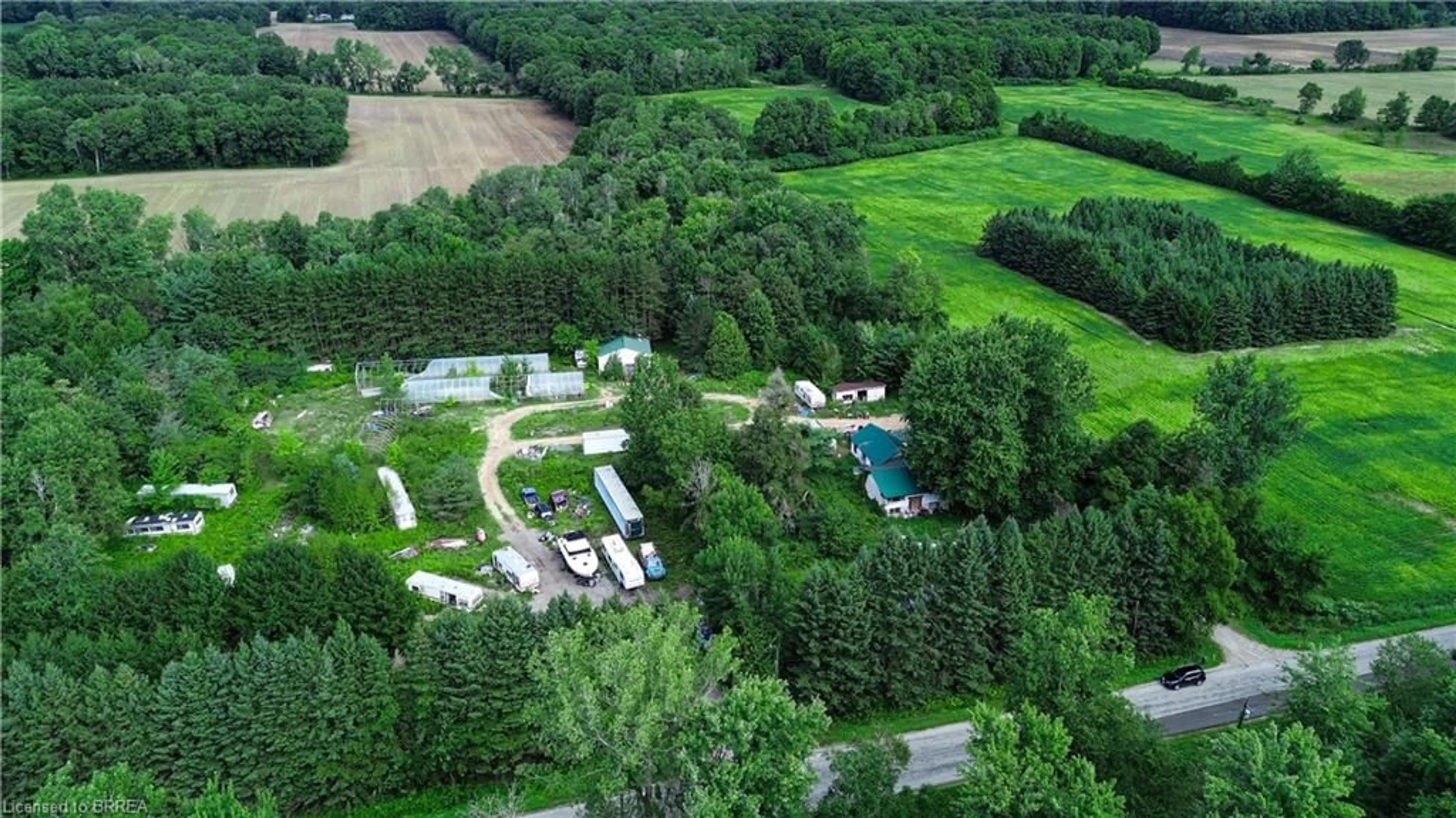 A pic from outside/outdoor area/front of a property/back of a property/a pic from drone, forest/trees view for 1069 Windham 13 Rd, Nixon Ontario N3Y 4K3