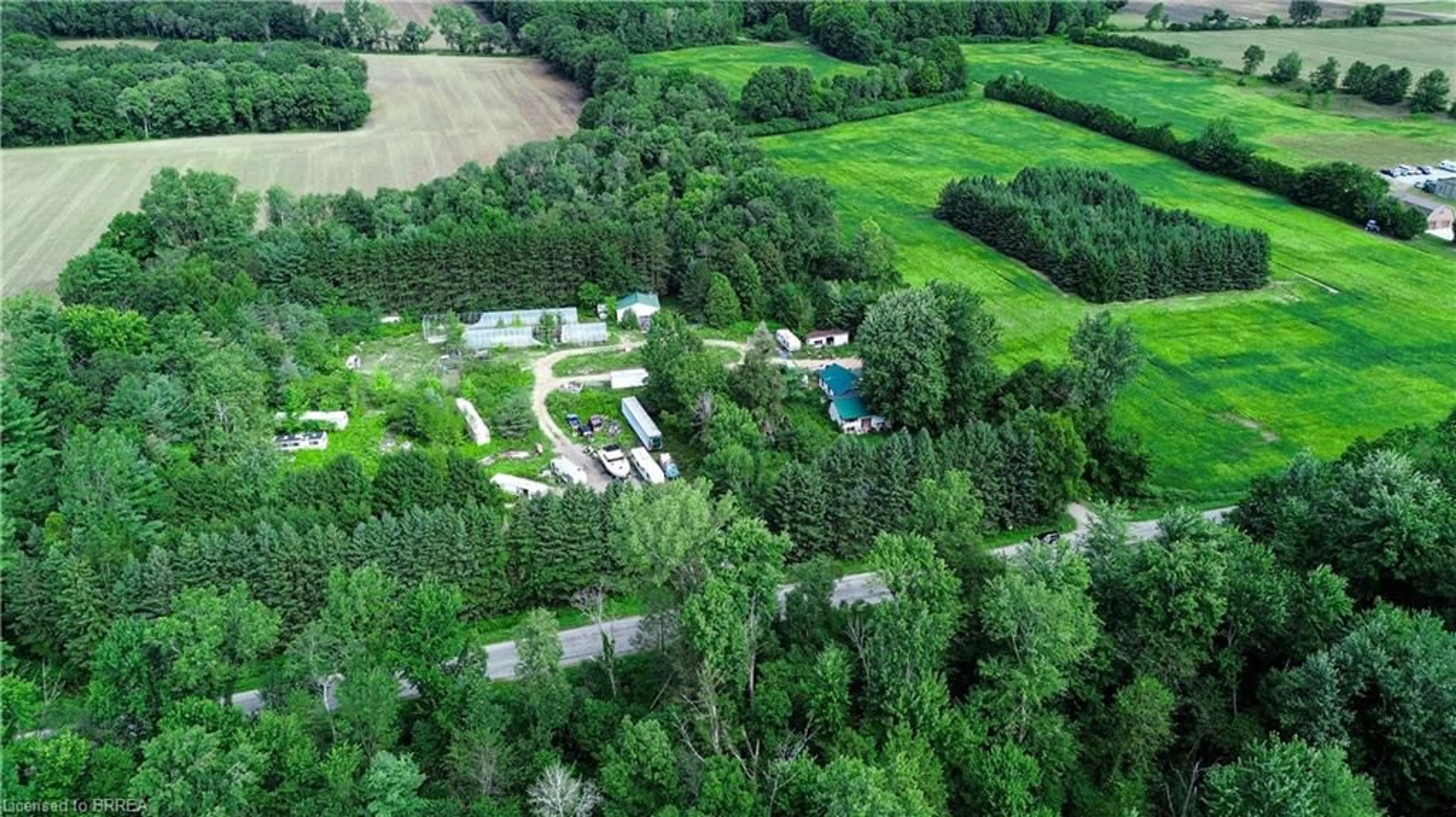 A pic from outside/outdoor area/front of a property/back of a property/a pic from drone, forest/trees view for 1069 Windham 13 Rd, Nixon Ontario N3Y 4K3