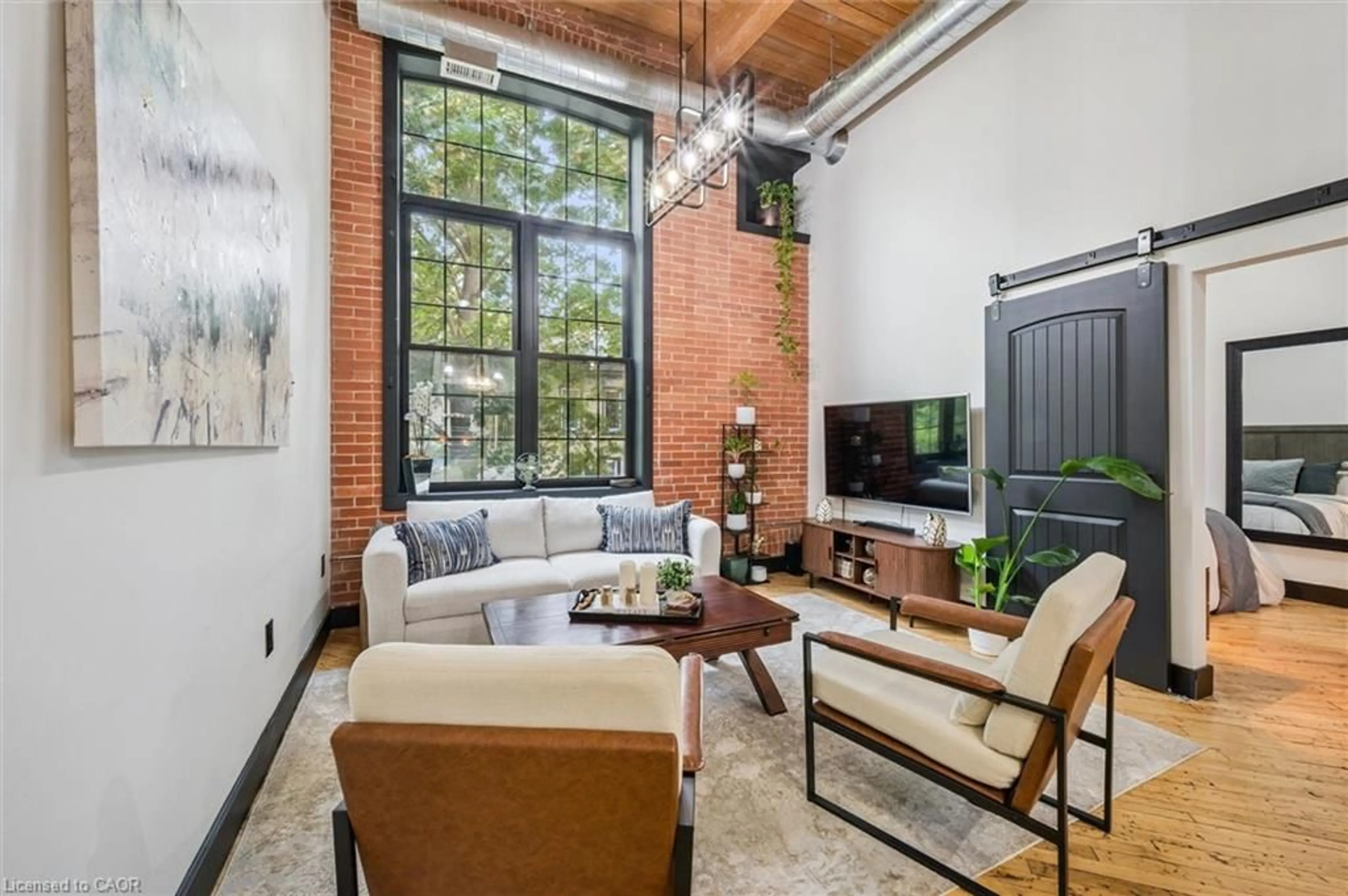 Living room with furniture, unknown for 24 Cedar St #303, Cambridge Ontario N1S 0B2