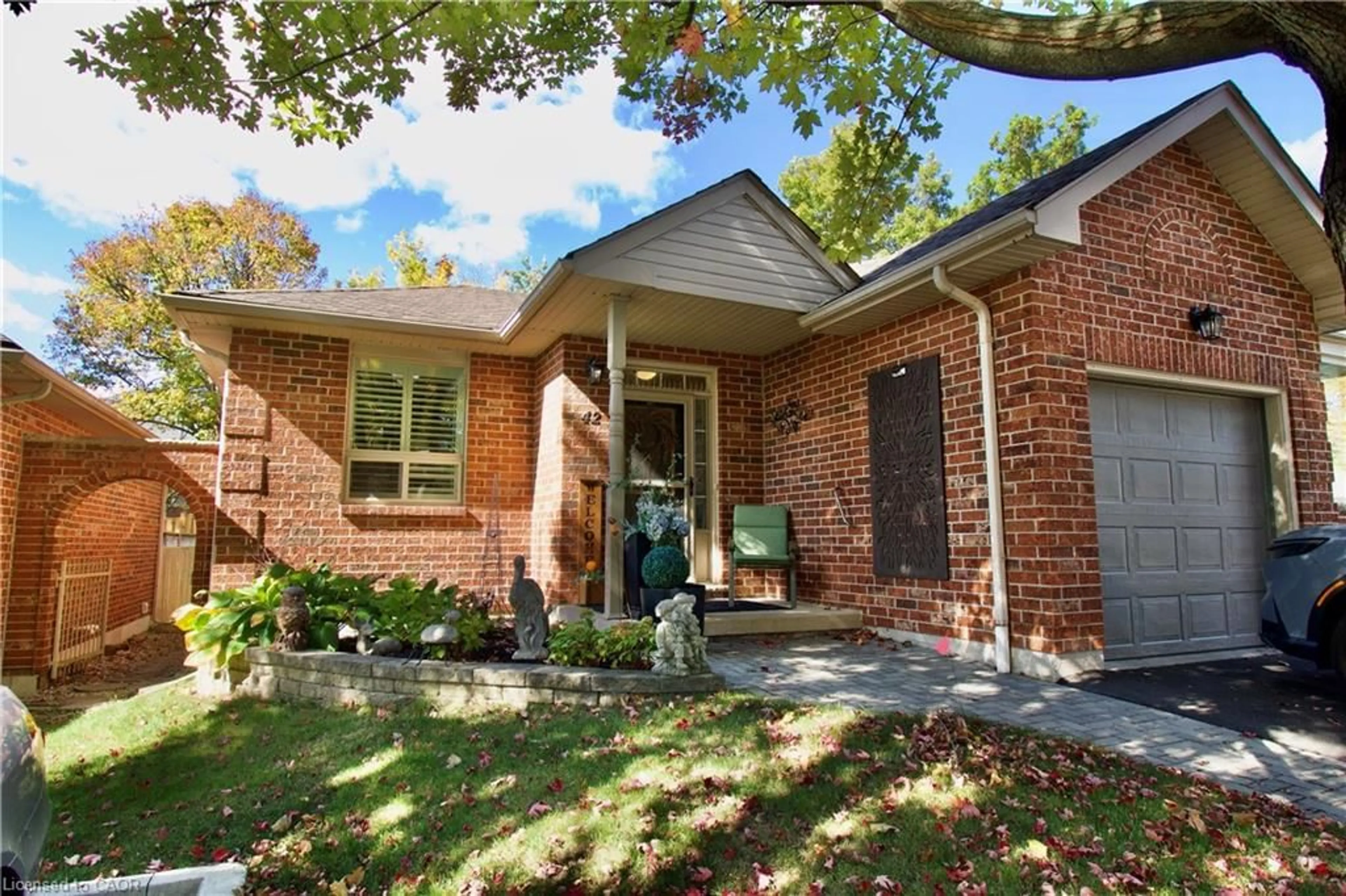 Home with brick exterior material, street for 42 Greentrail Dr, Hamilton Ontario L0R 1W0