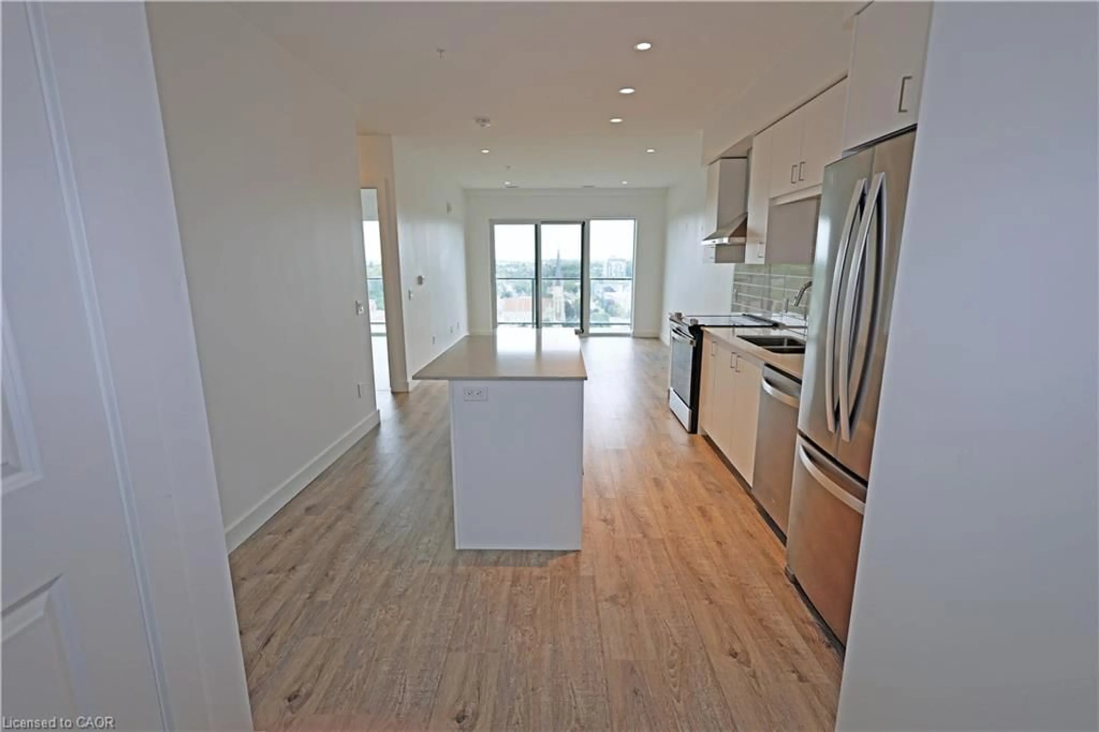 Open concept kitchen, wood/laminate floor for 50 Grand Ave #1311, Cambridge Ontario N1S 0C2