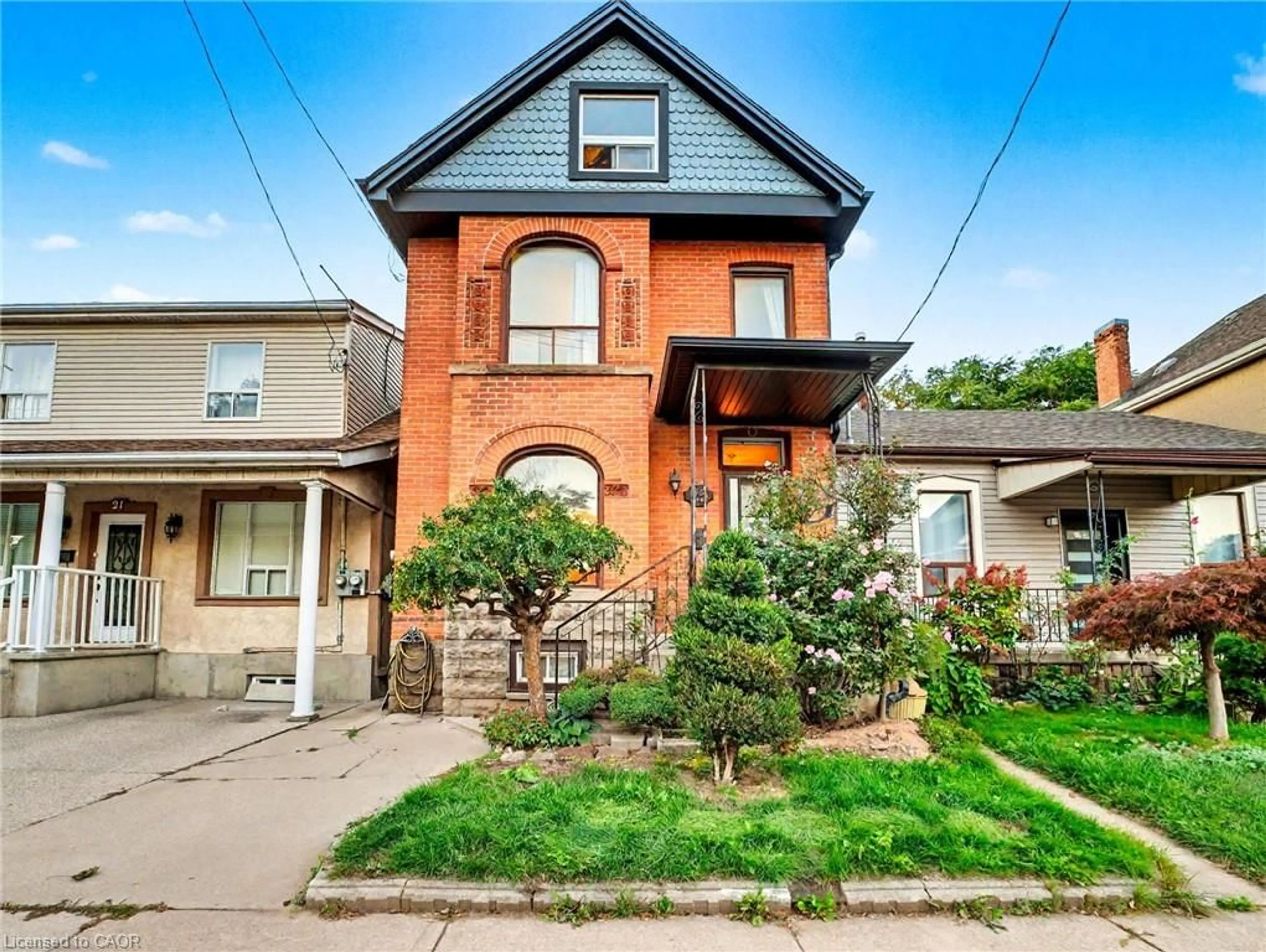 Home with brick exterior material, street for 23 Oak Ave, Hamilton Ontario L8L 5M7