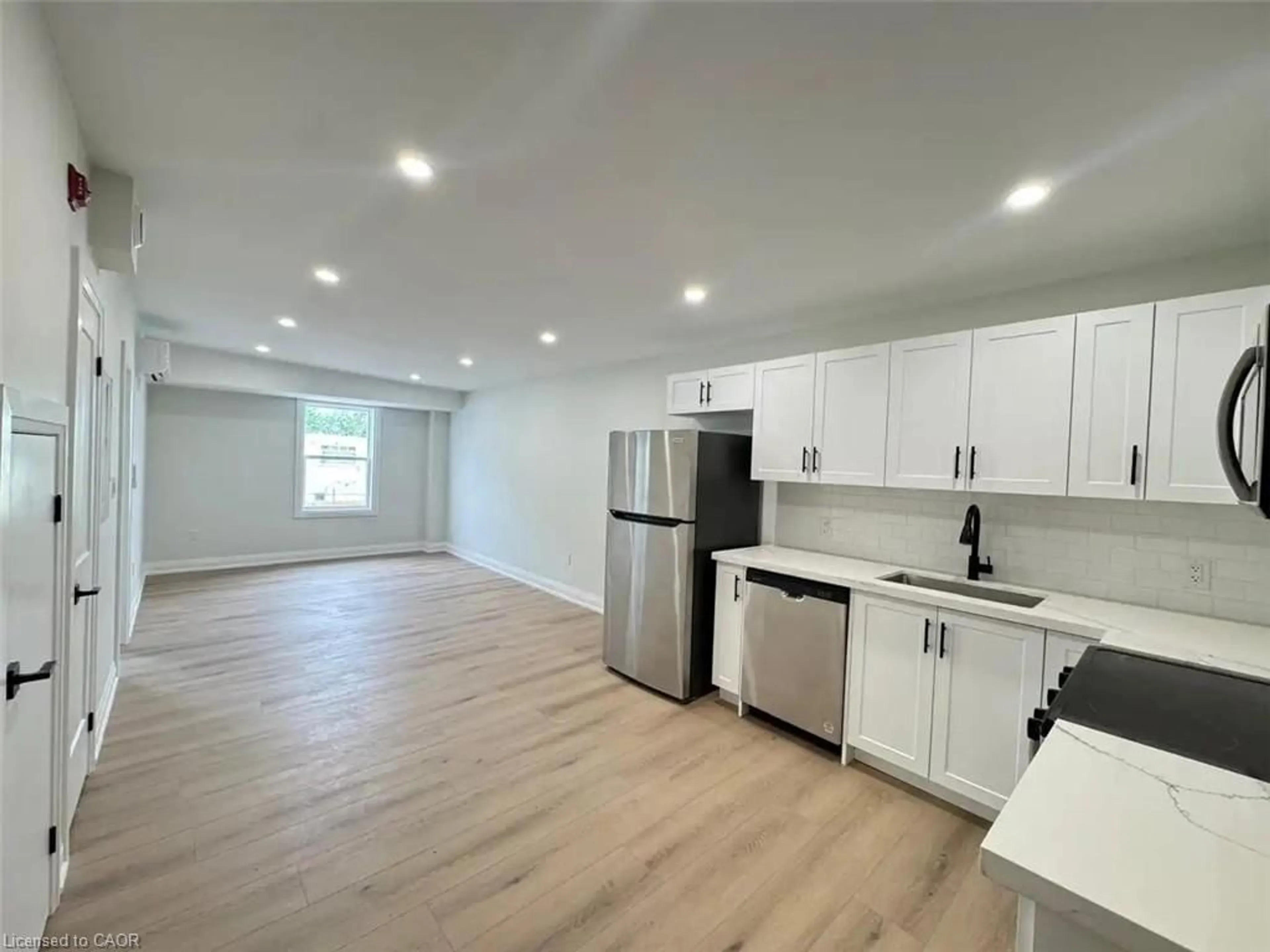 Open concept kitchen, wood/laminate floor for 53 Ontario Rd #7, Welland Ontario L3B 5C2