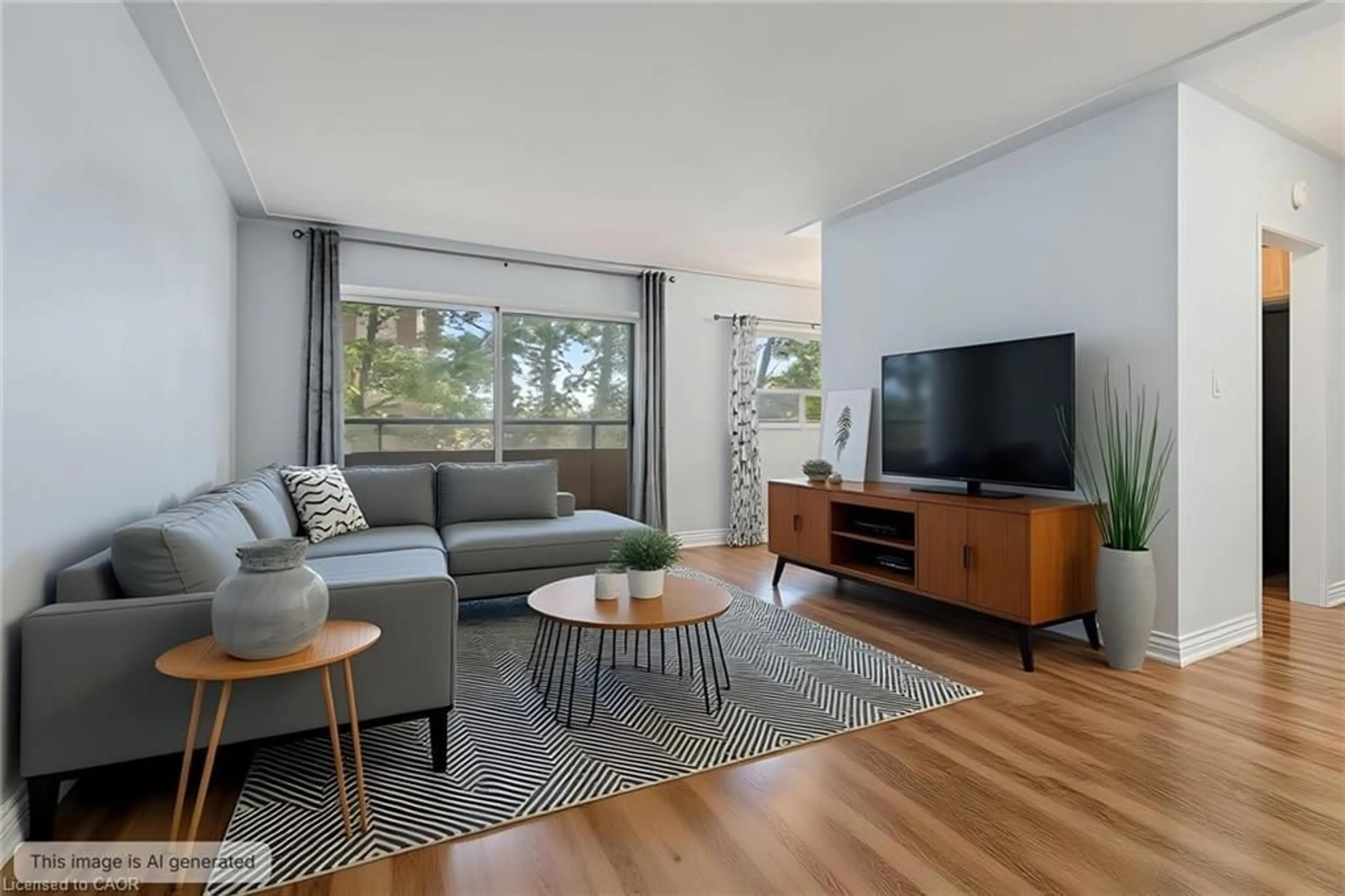 Living room with furniture, wood/laminate floor for 11 Woodman Dr #203, Hamilton Ontario L8K 4E3