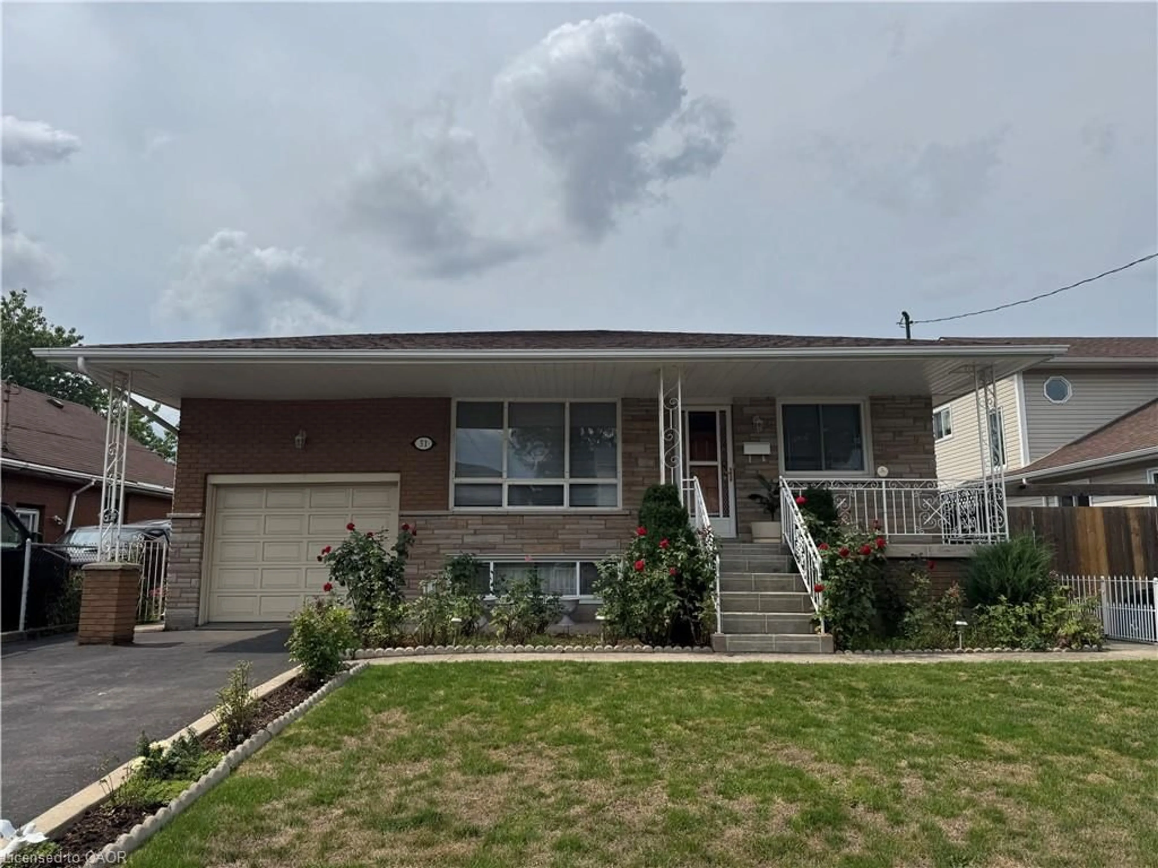 Home with vinyl exterior material, street for 31 Adair Ave, Hamilton Ontario L8H 6A5