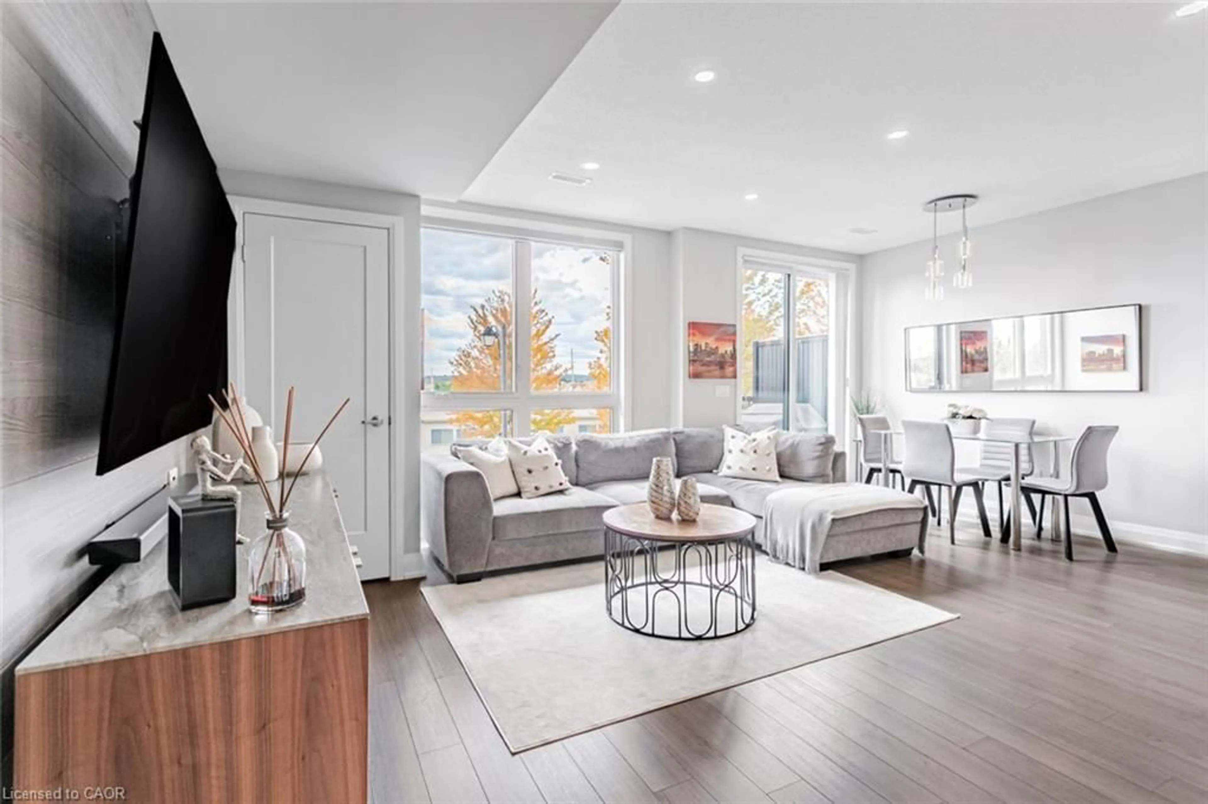 Living room with furniture, unknown for 1210 Main St #203, Milton Ontario L9T 9K8