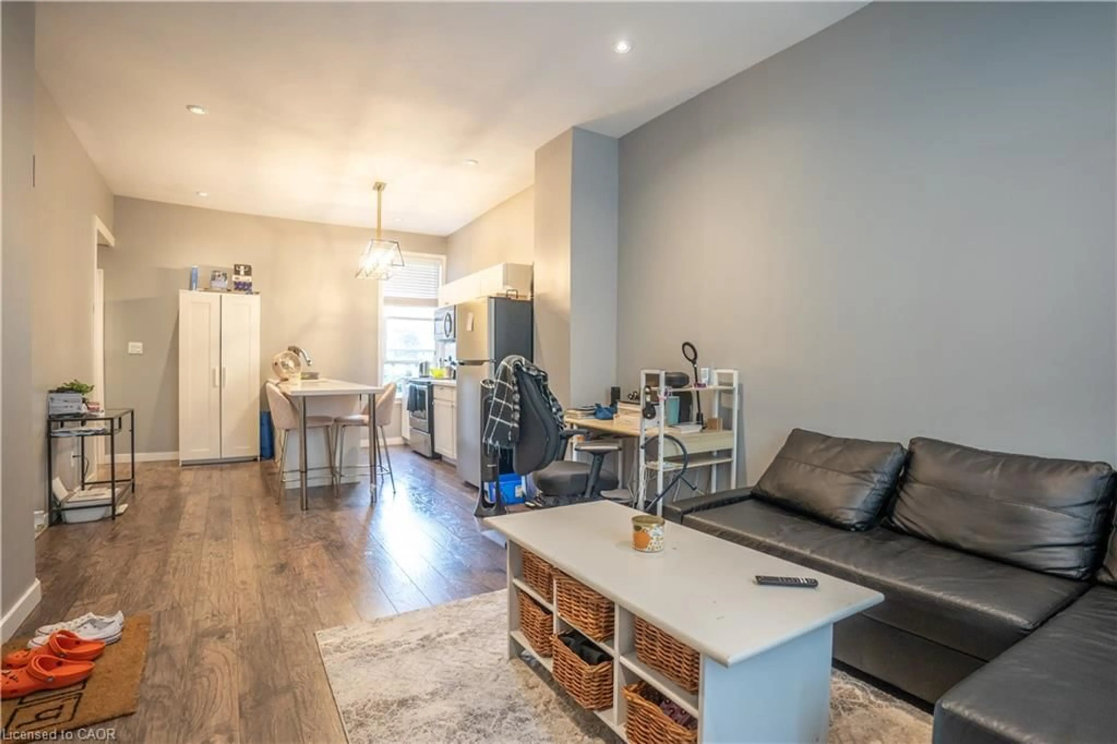Living room with furniture, wood/laminate floor for 165 Emerald St, Hamilton Ontario L8L 5K9