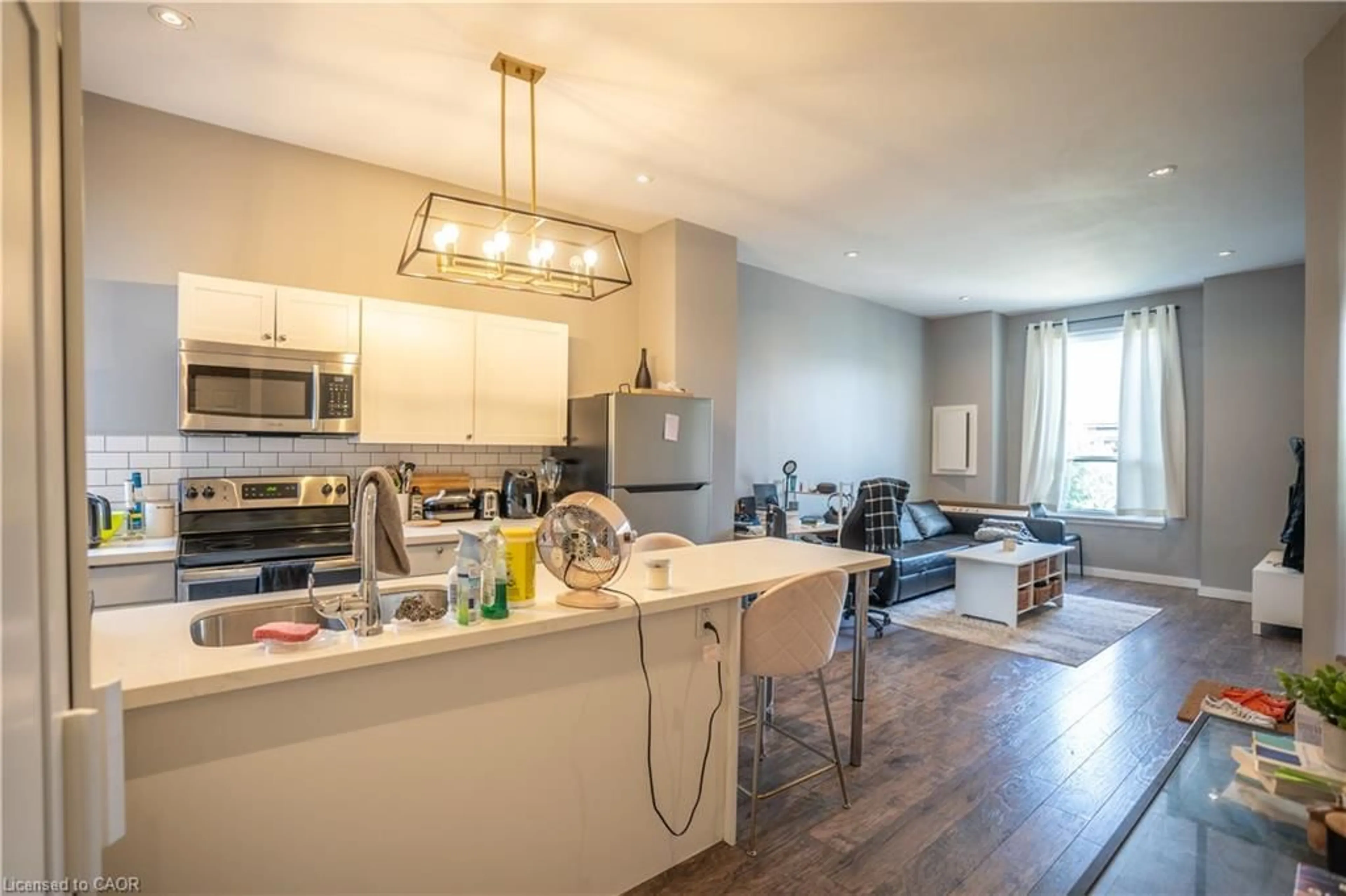 Open concept kitchen, wood/laminate floor for 165 Emerald St, Hamilton Ontario L8L 5K9