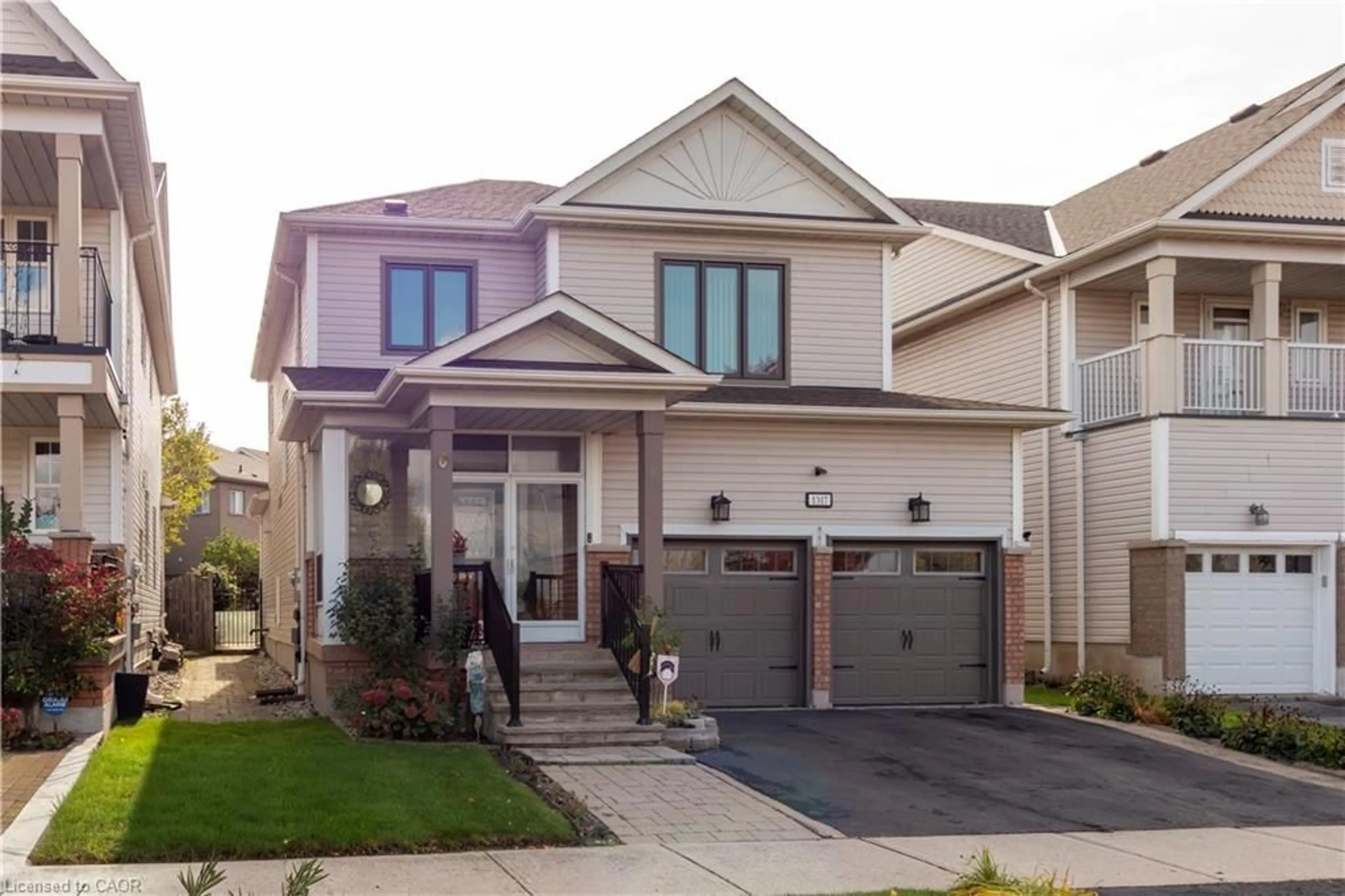 Home with vinyl exterior material, street for 1317 Roper Dr, Milton Ontario L9T 6E5