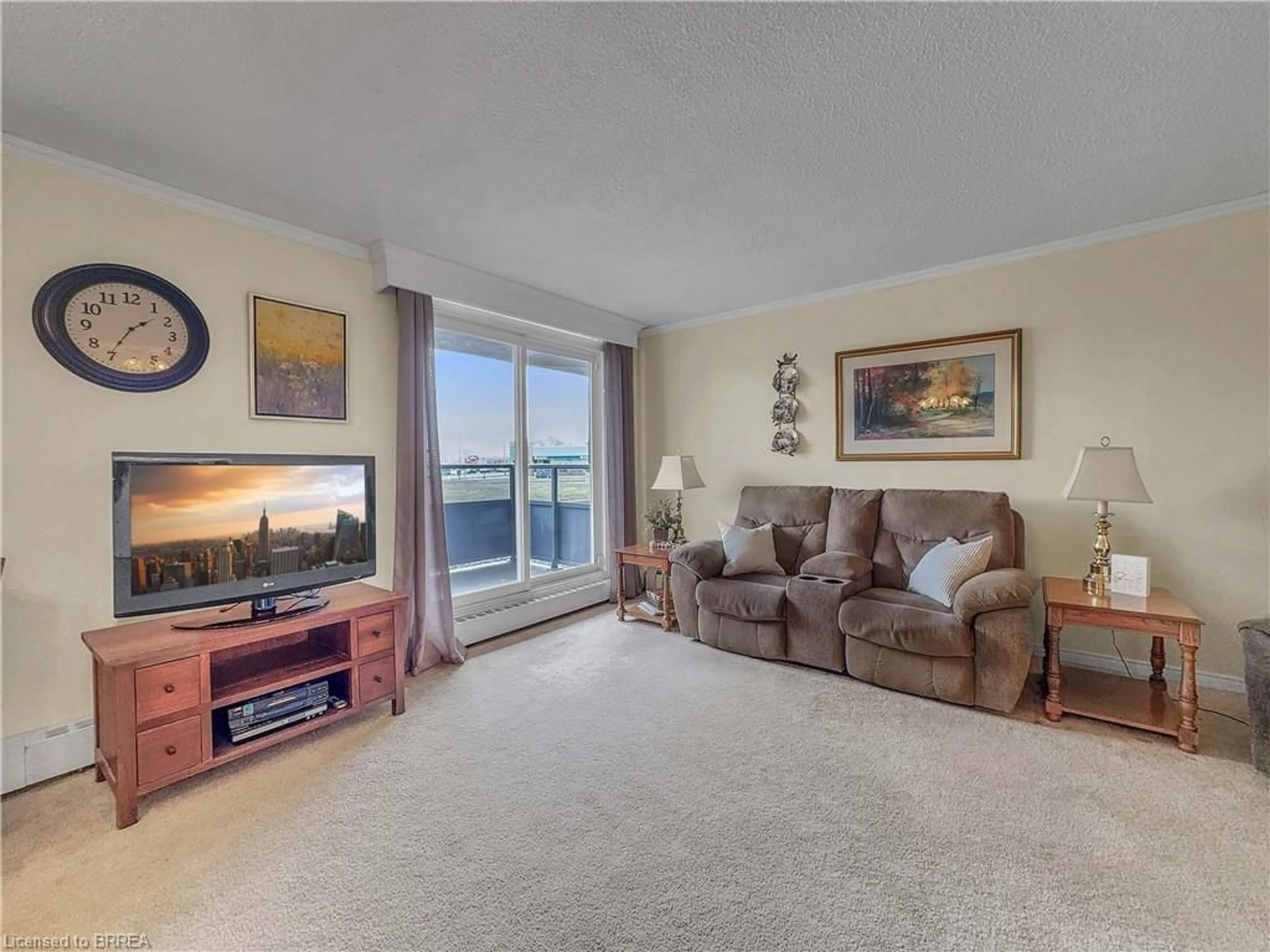Living room with furniture, carpet floor for 640 West St #101, Brantford Ontario N3R 6M3