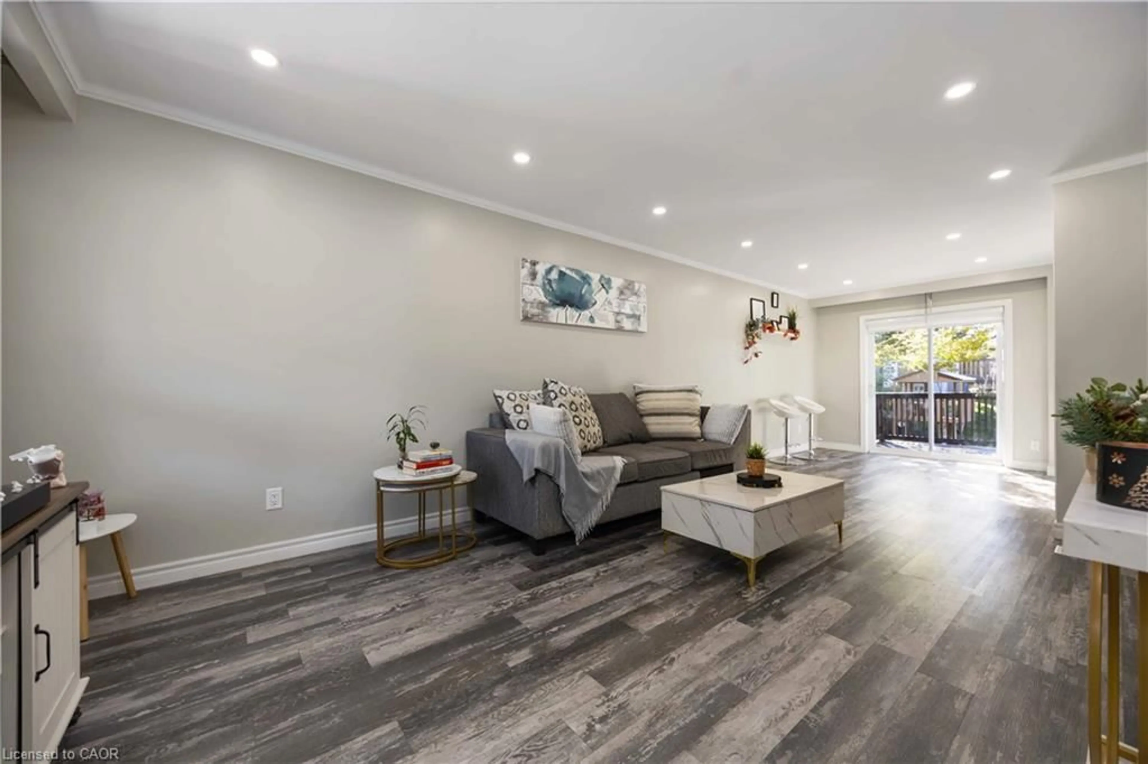 Living room with furniture, wood/laminate floor for 1057 King St, Oshawa Ontario L1H 1H6