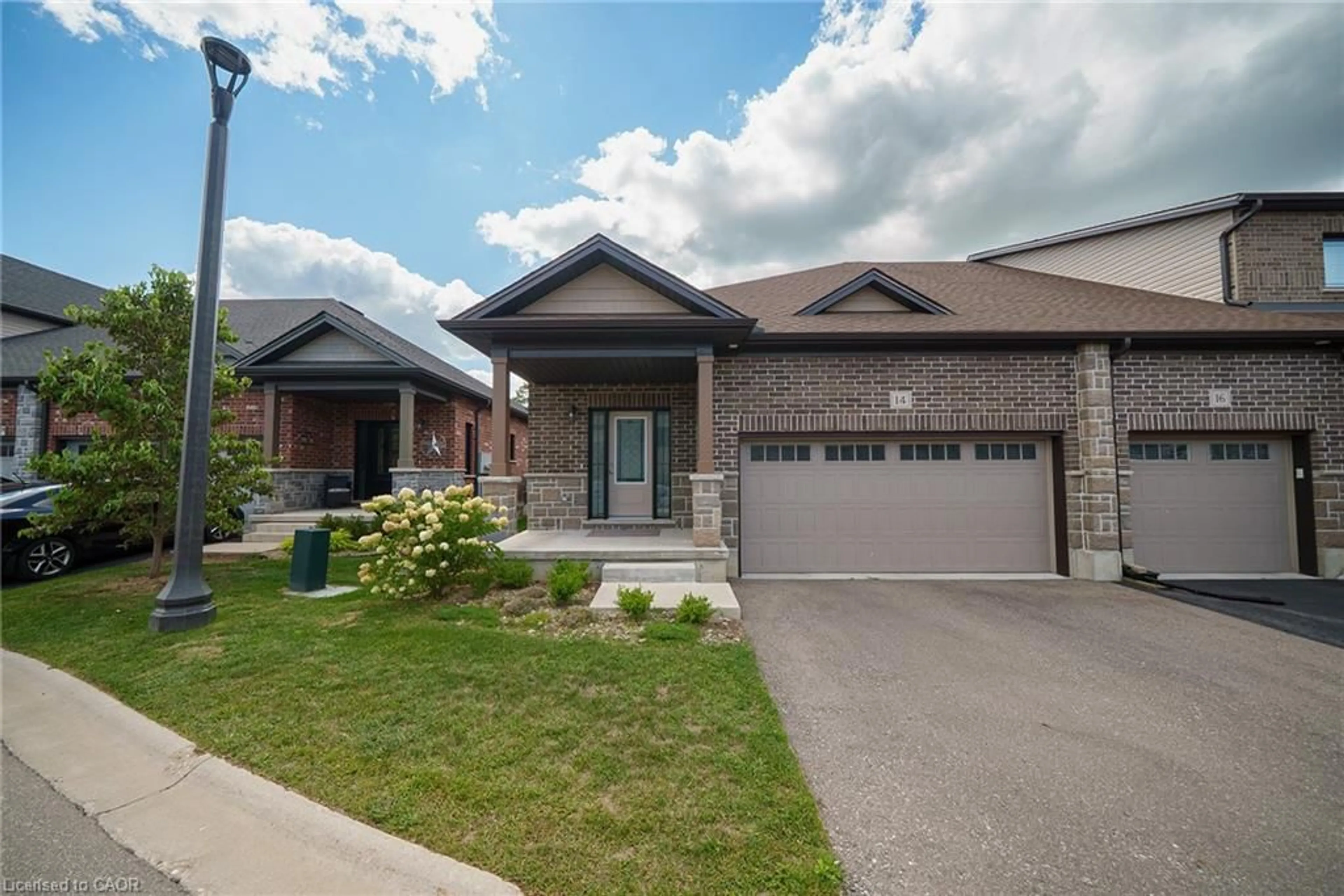 Home with brick exterior material, street for 14 Tamarack Way, Simcoe Ontario N3Y 0E5