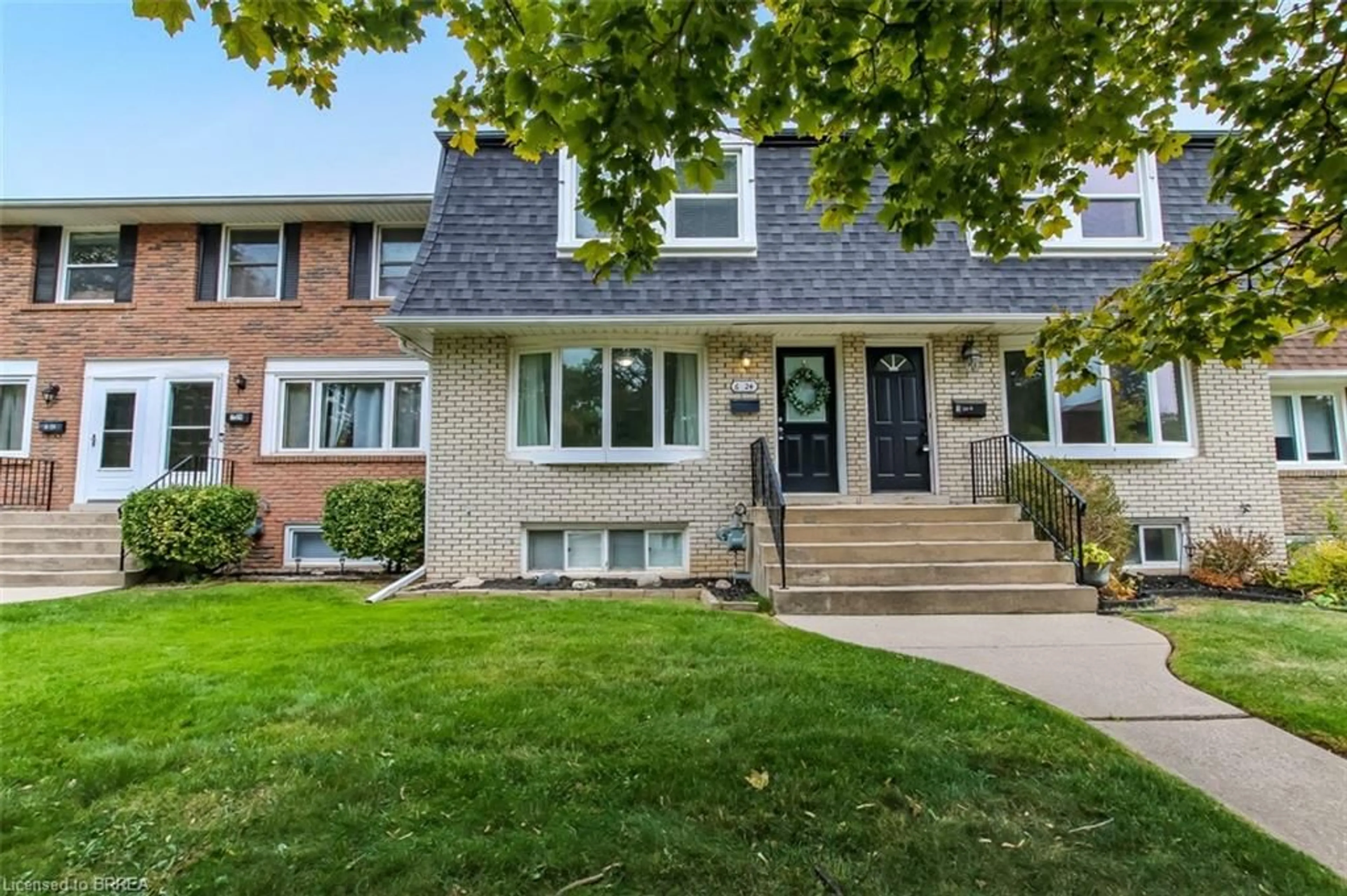 Home with brick exterior material, street for 24 Coachwood Rd #6, Brantford Ontario N3R 3R4