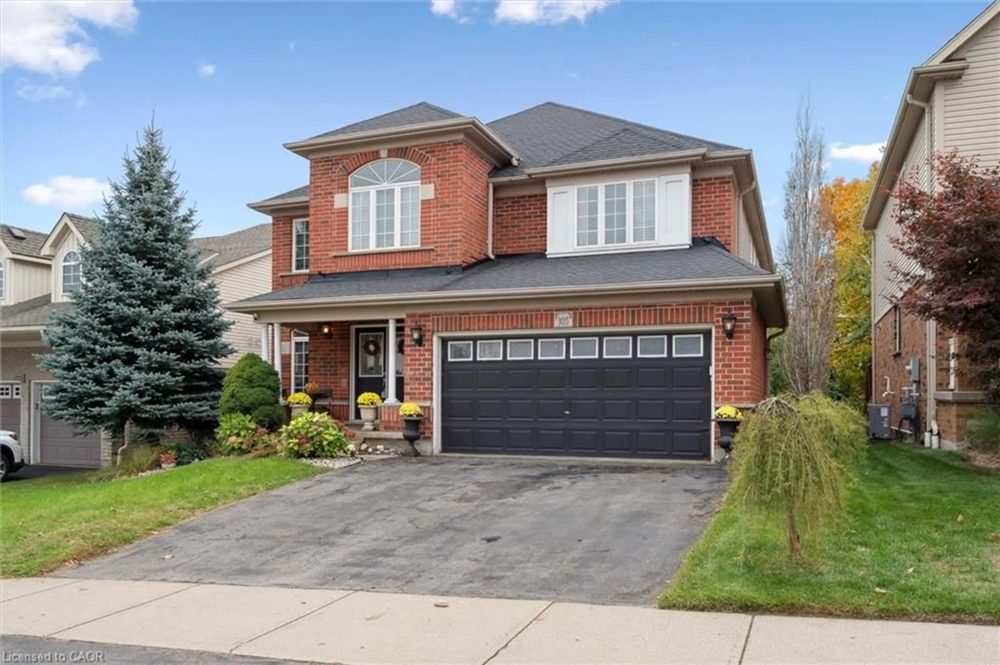 Home with brick exterior material, street for 305 Pine Valley Dr, Kitchener Ontario N2P 2V5