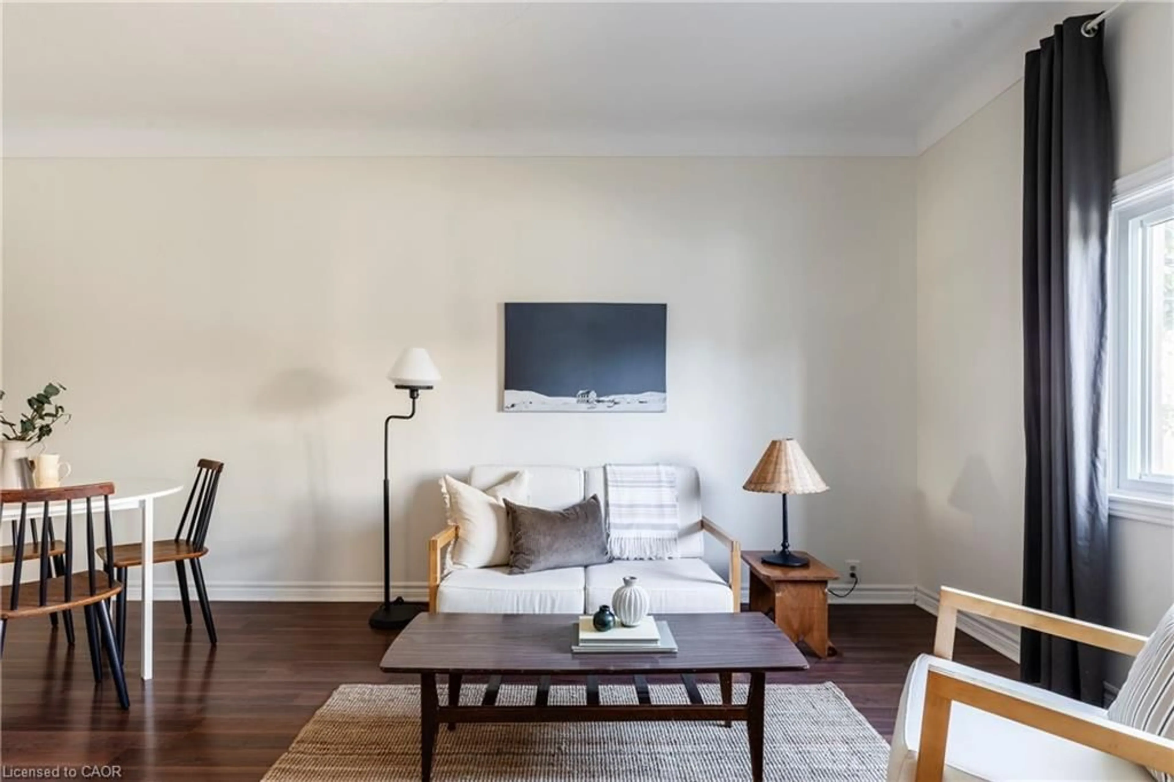 Living room with furniture, wood/laminate floor for 133 Breadalbane St, Hamilton Ontario L8R 3G7