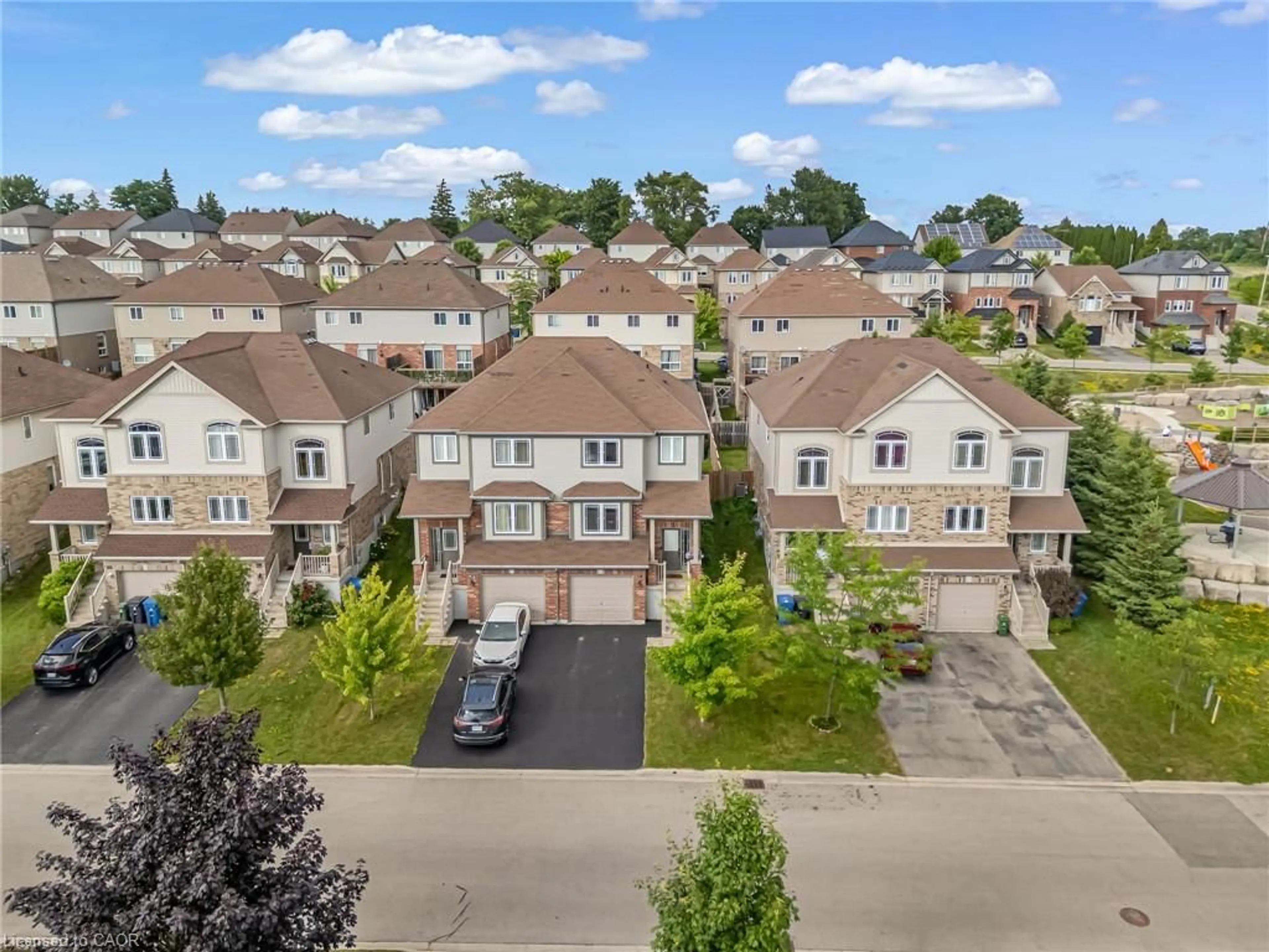A pic from outside/outdoor area/front of a property/back of a property/a pic from drone, street for 19 Oakes Cres, Guelph Ontario N1E 7K3