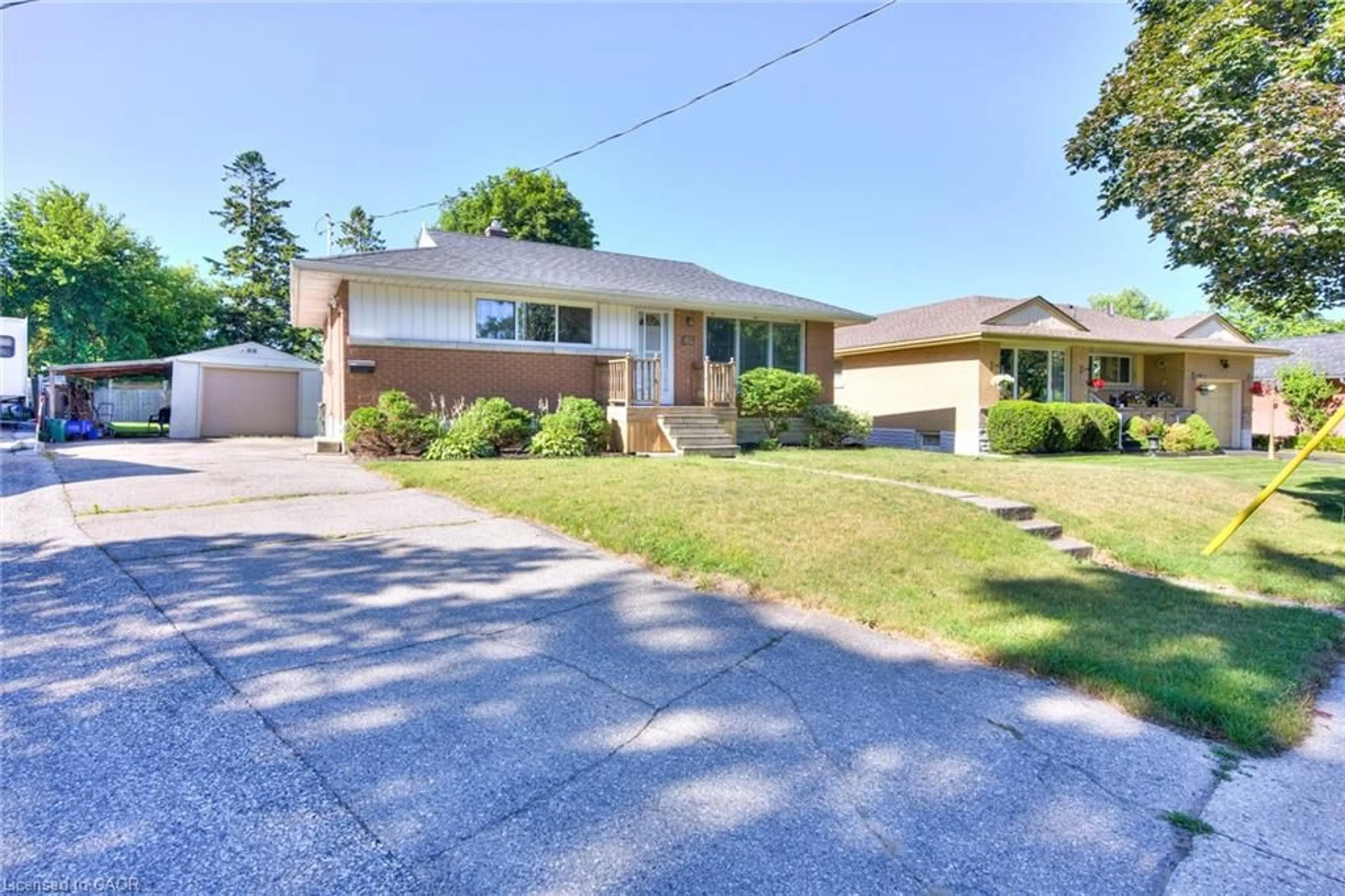 Home with brick exterior material, street for 71 Broadmoor Ave, Kitchener Ontario N2C 1Y6