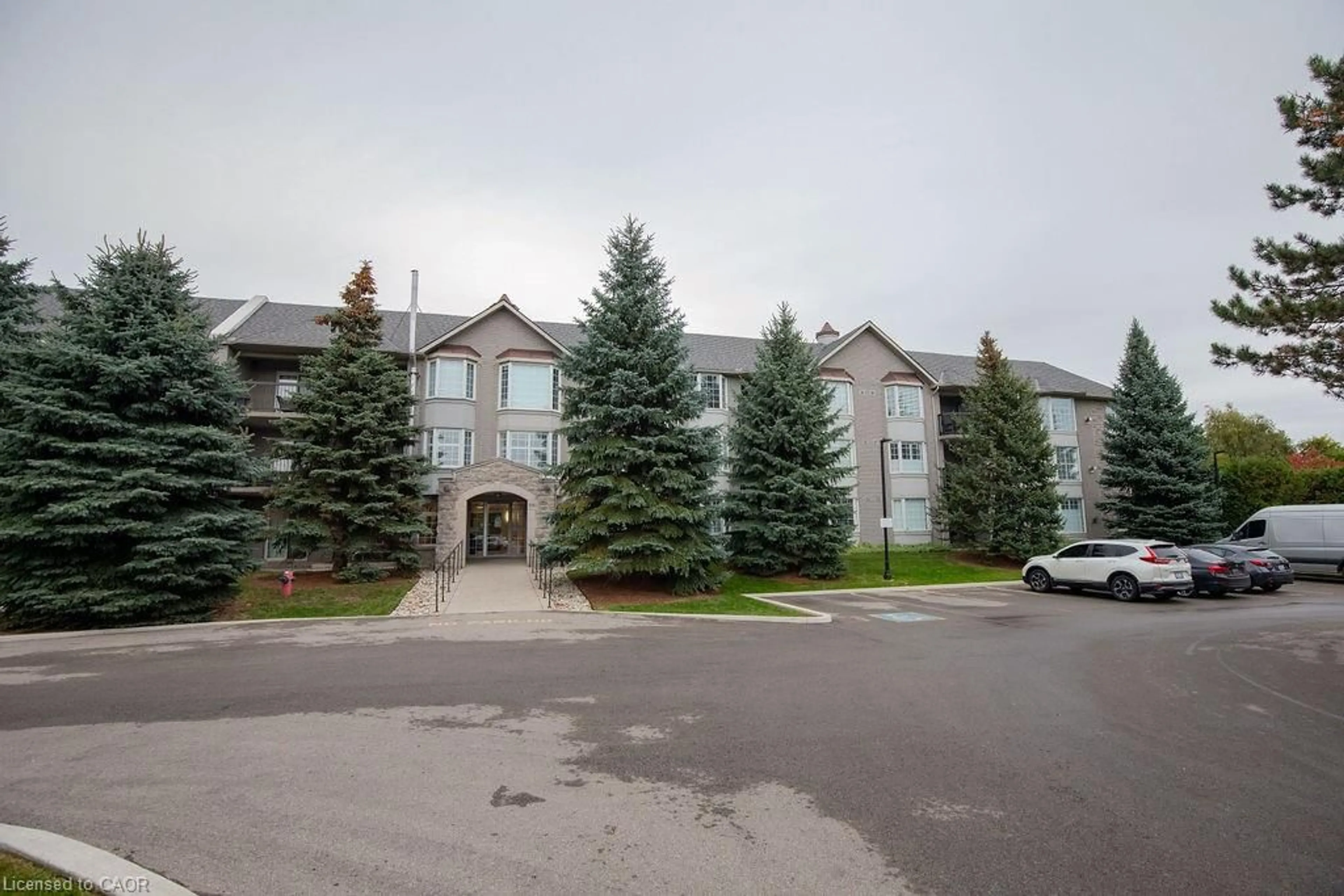 A pic from outside/outdoor area/front of a property/back of a property/a pic from drone, unknown for 990 Golf Links Rd #202, Hamilton Ontario L9K 1J8