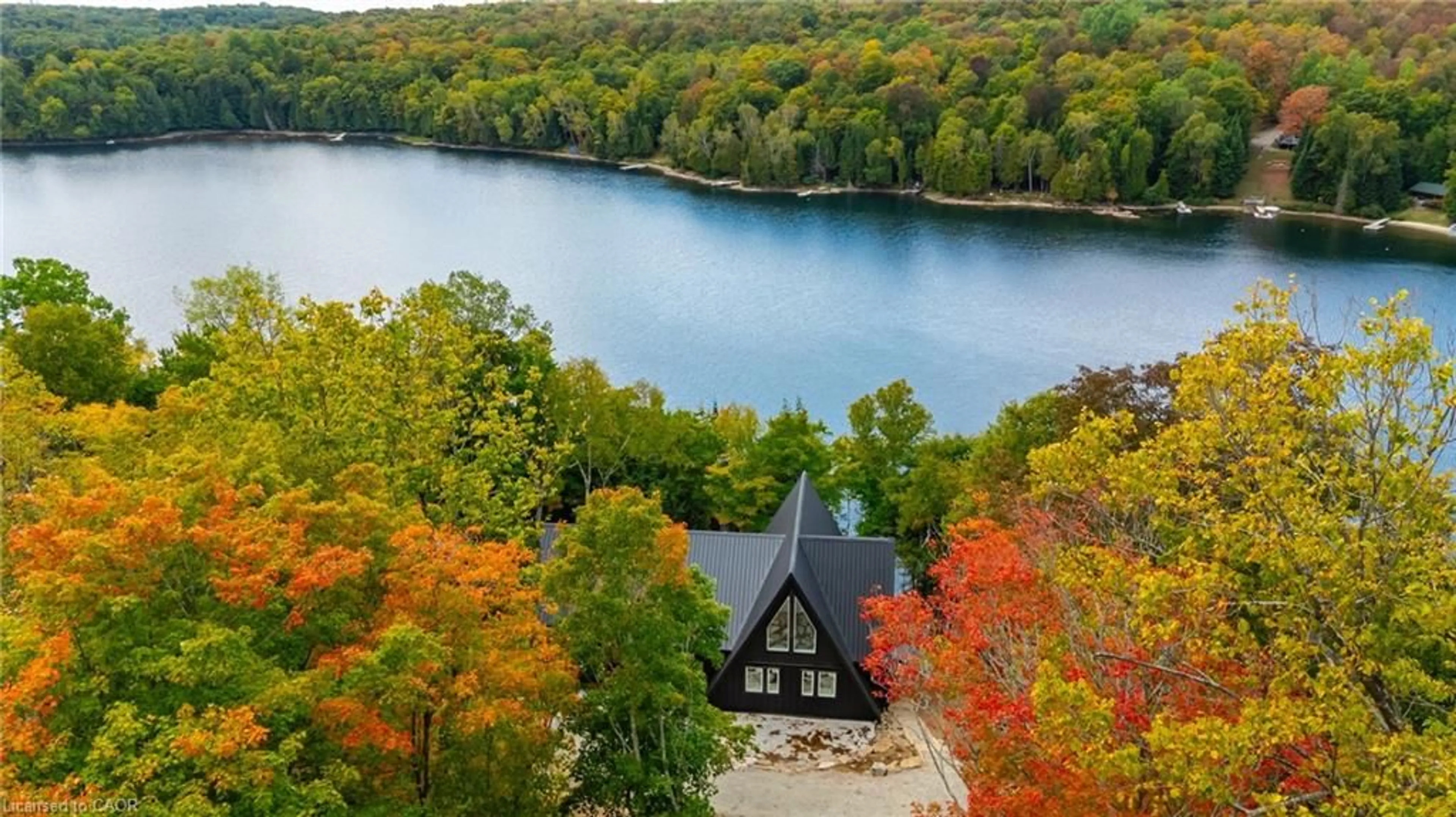 A pic from outside/outdoor area/front of a property/back of a property/a pic from drone, water/lake/river/ocean view for 1295 Wenona Lake Rd, Haliburton Ontario K0M 1S0