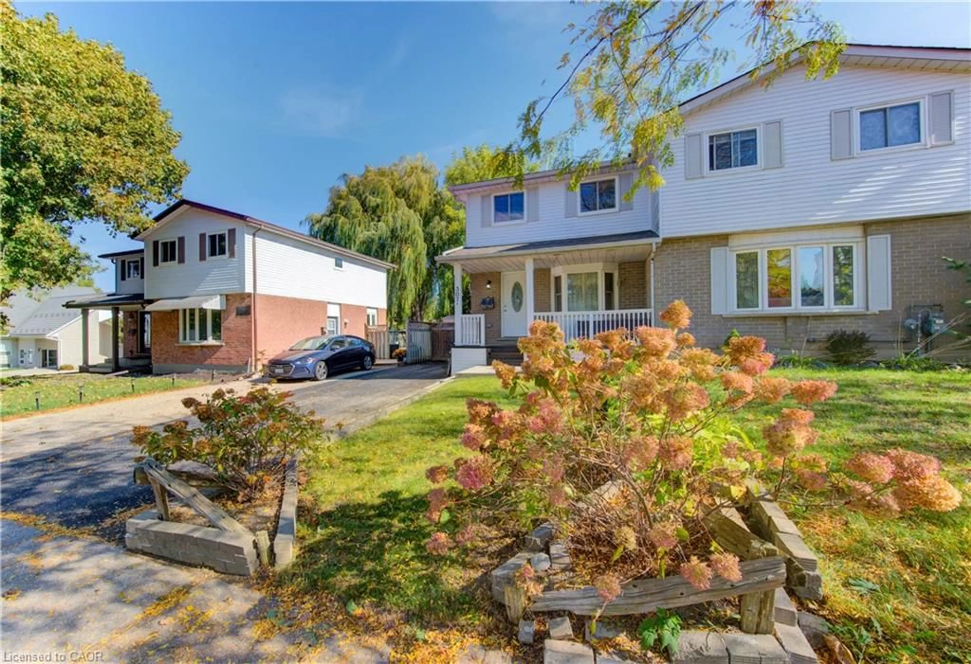 A pic from outside/outdoor area/front of a property/back of a property/a pic from drone, street for 307 Northlake Dr #A, Waterloo Ontario N2V 1W5
