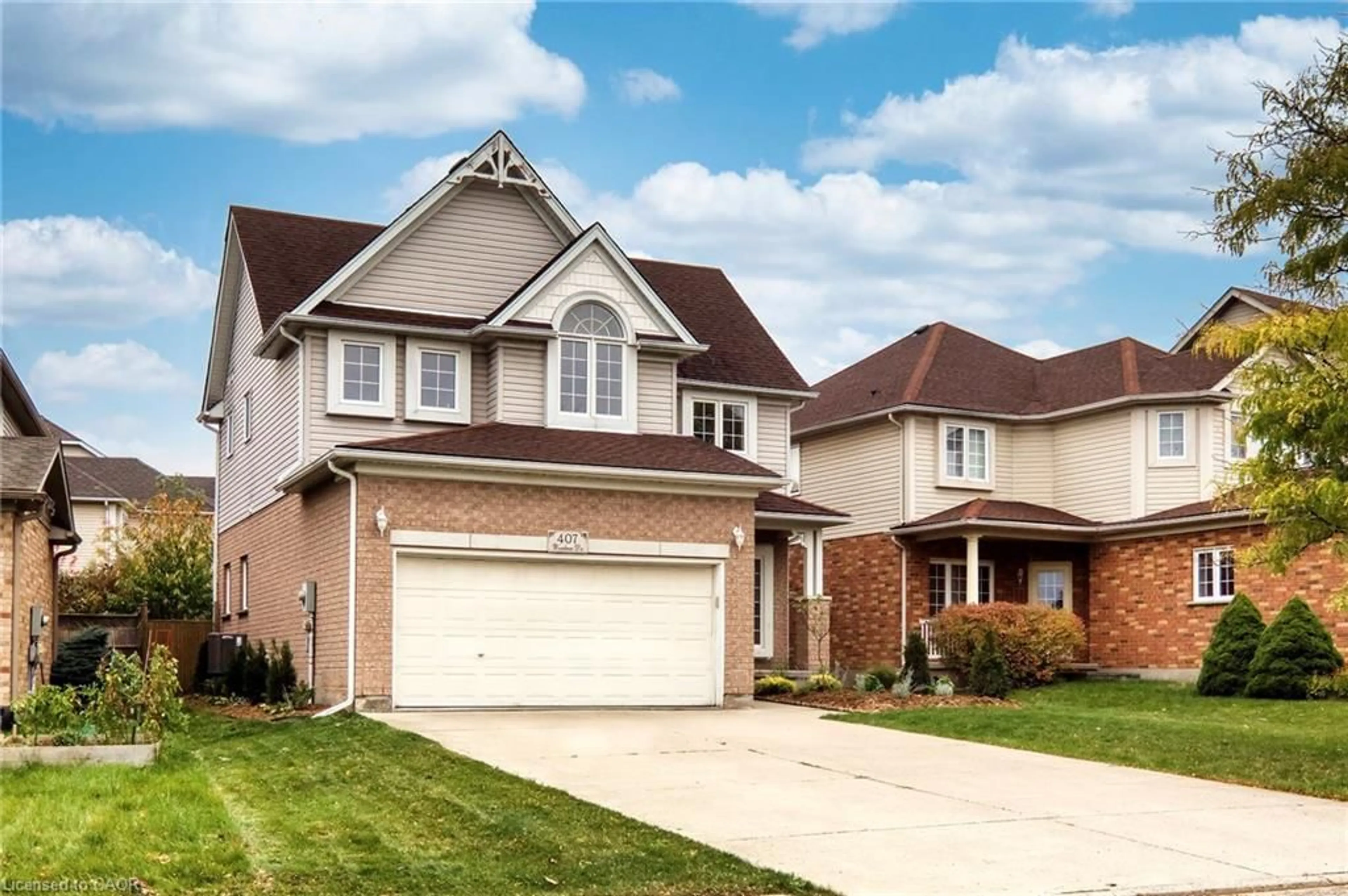 Home with brick exterior material, street for 407 Woodrow Dr, Waterloo Ontario N2T 2V7